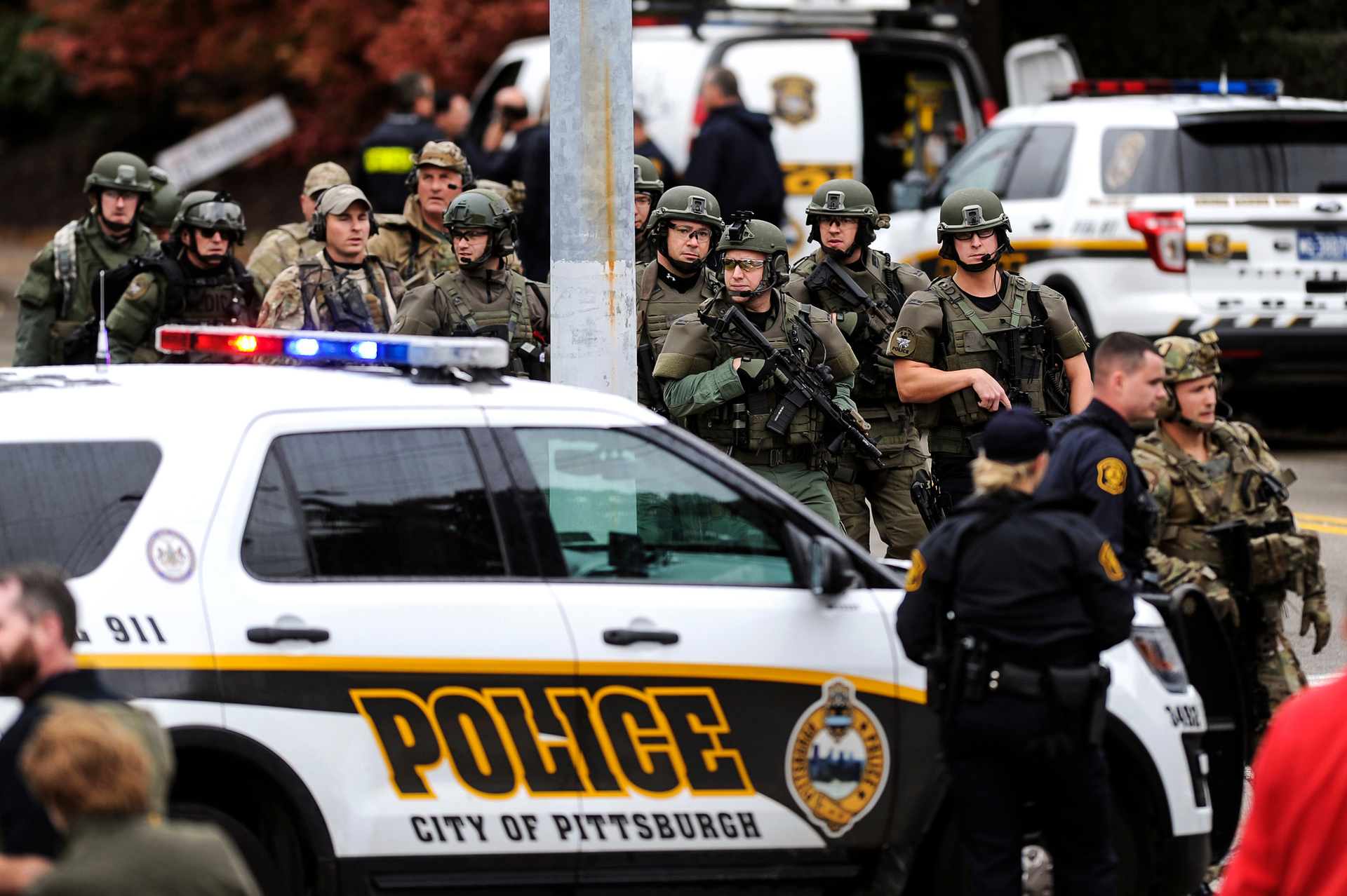 Law enforcement officers secure the scene where multiple people were shot. Photo / AP
