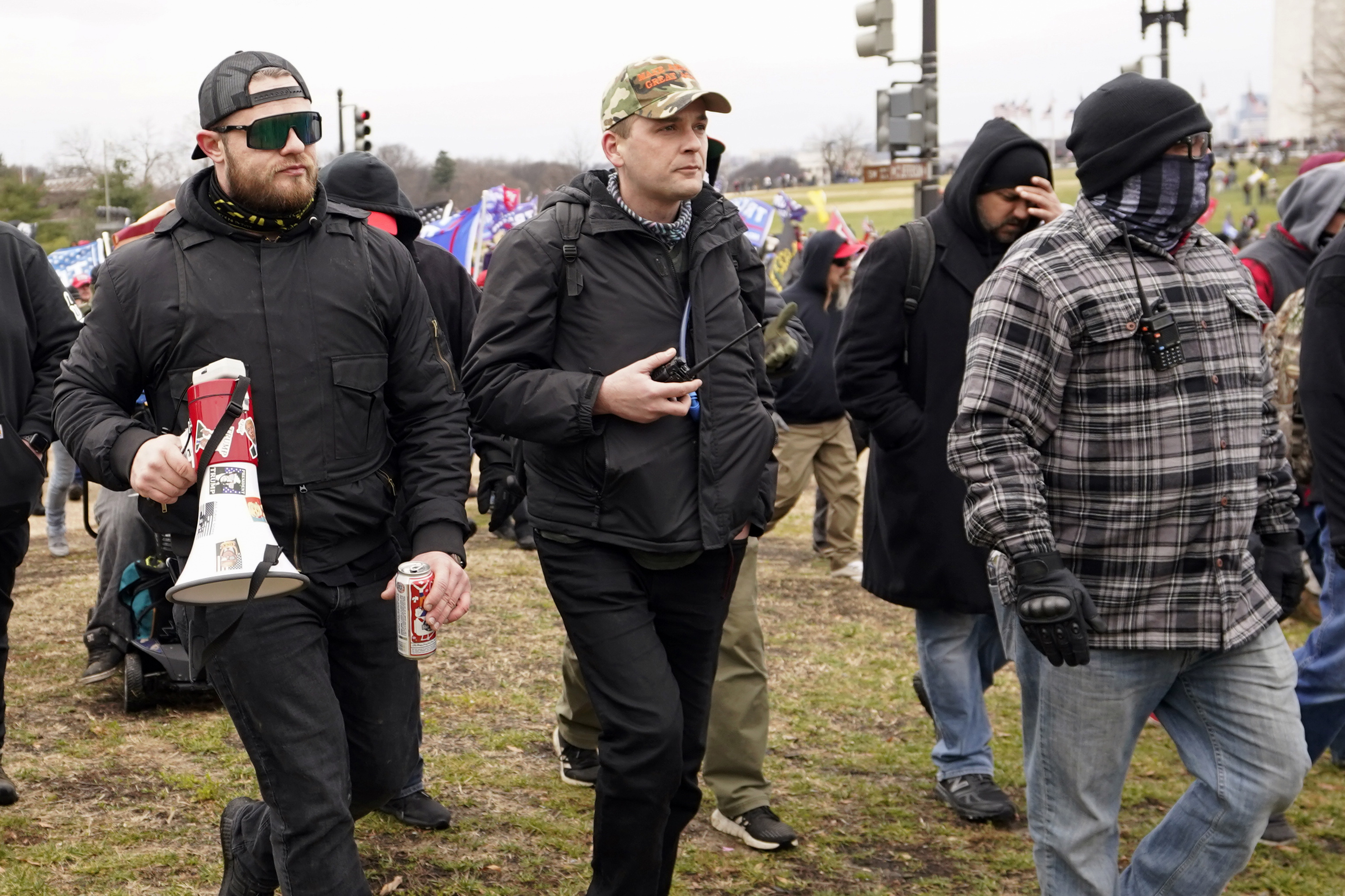 Proud Boys members Ethan Nordean (left), Zachary Rehl and Joseph Biggs walk toward the US Capitol in Washington. Photo / AP
