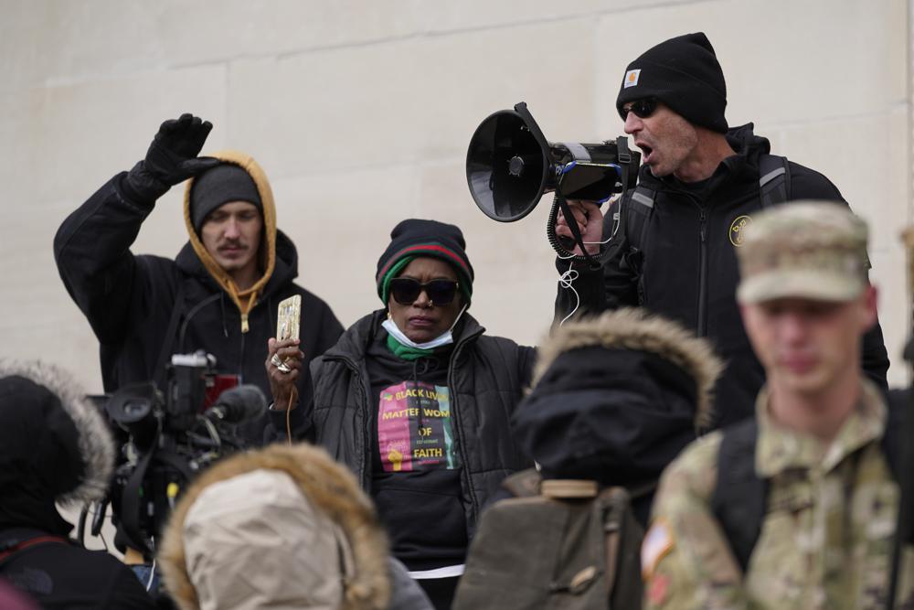 Protesters stand outside the Kenosha County Courthouse, during the Kyle Rittenhouse murder trial, Thursday, Nov. 18, in Kenosha, Wis. Photo/AP