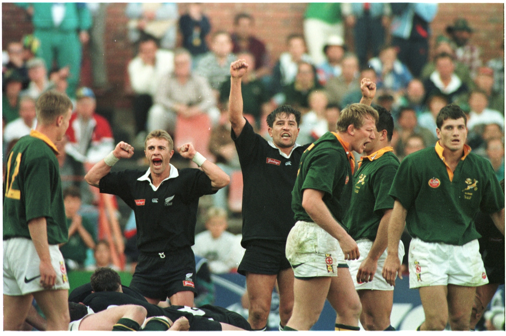 All Blacks Justin Marshall (left) and Zinzan Brooke celebrate victory over the Springboks in Pretoria. Photo / Paul Estcourt