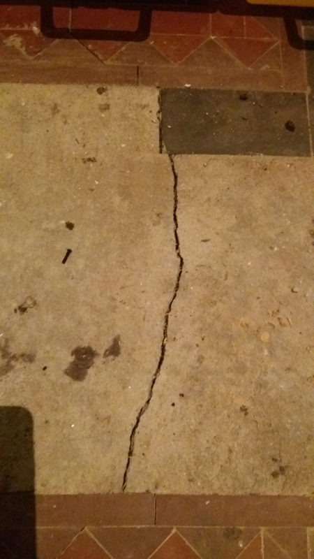 This image shows a crack in the floor which was beneath a model of the museum.