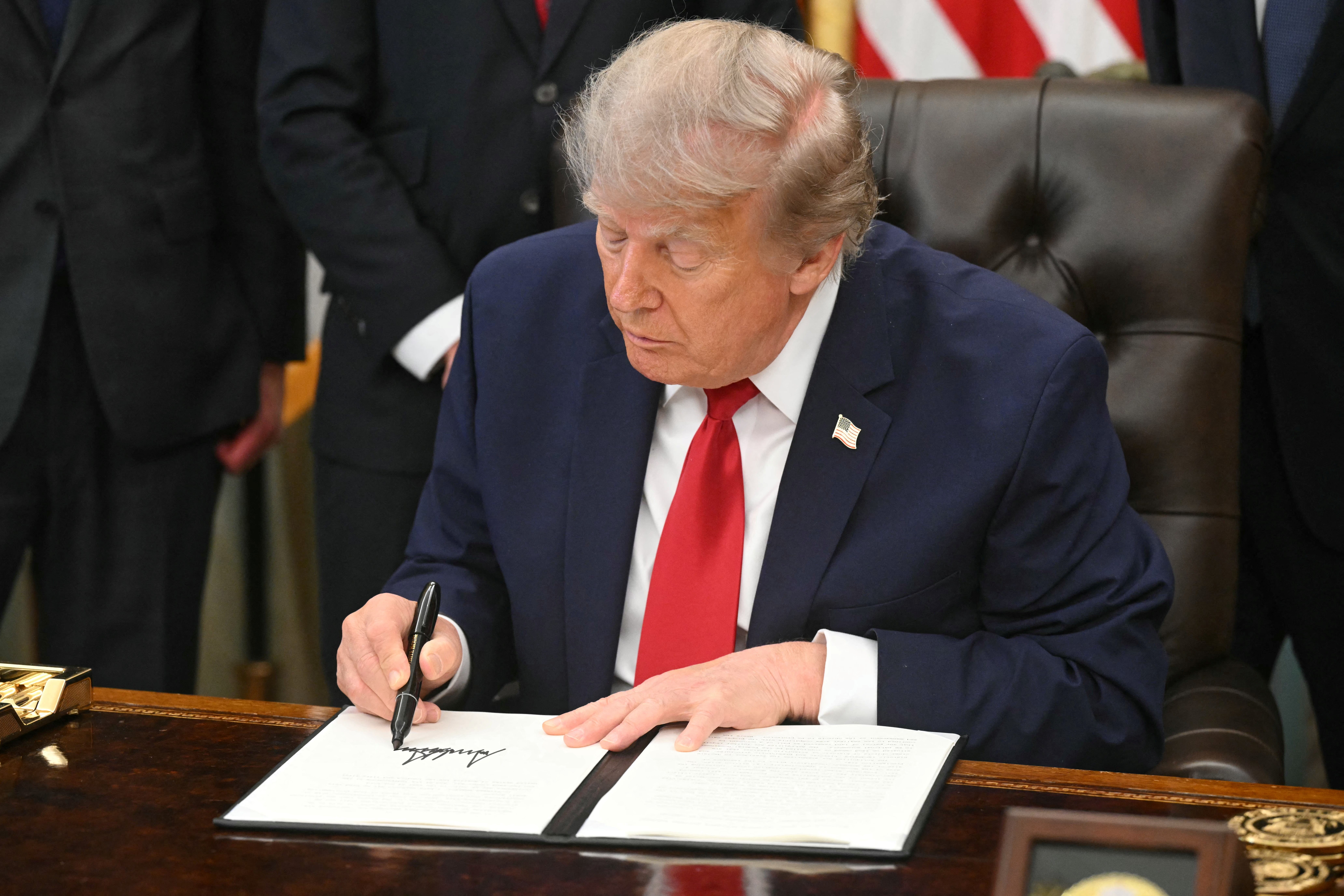 US President Donald Trump has rowed back on his plan to charge shipping with a fee to transit the Strait of Hormuz. Photo / AFP