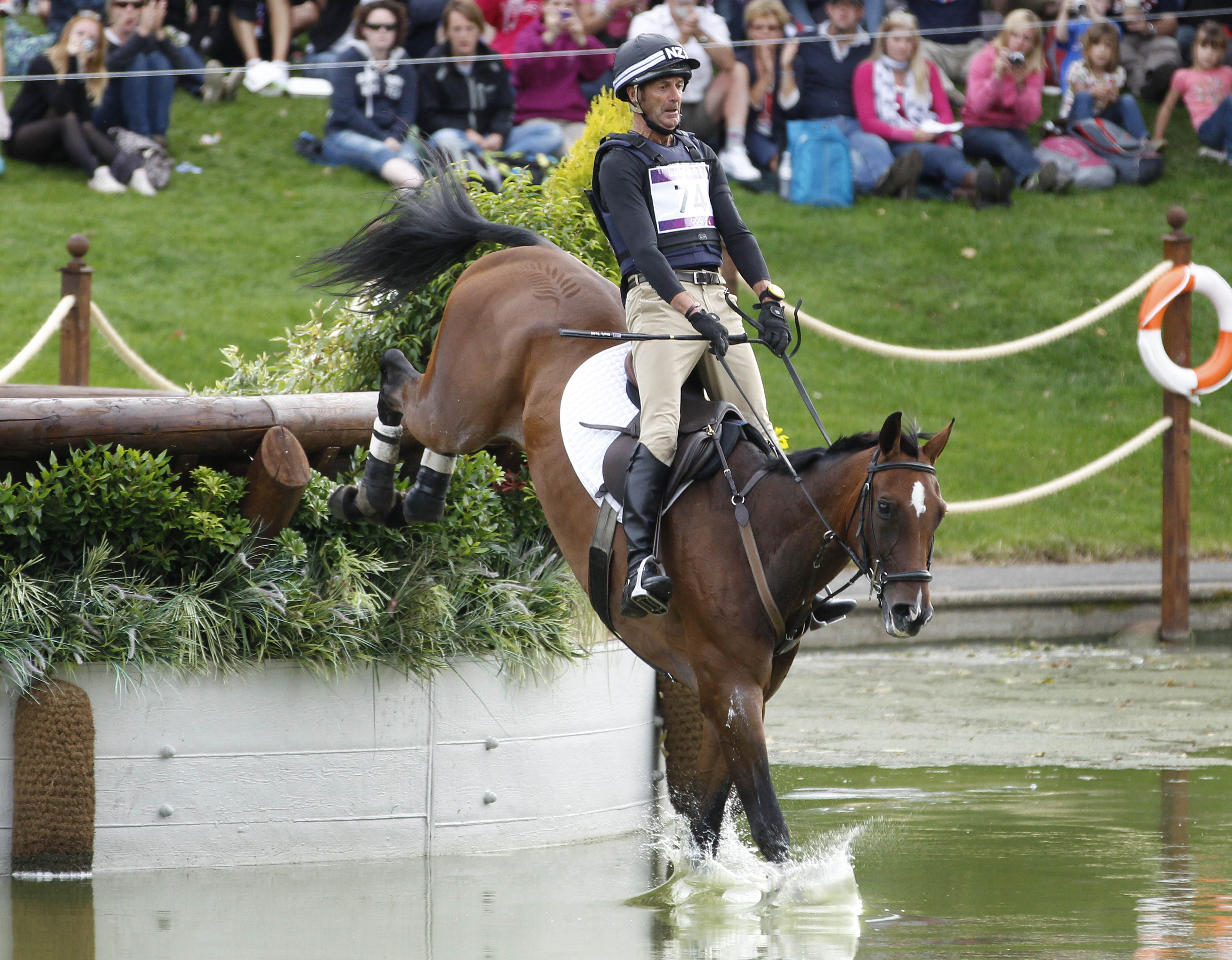 New Zealand's Mark Todd riding Campino taking on the water jumps in 2012. Photo / Mark Mitchell