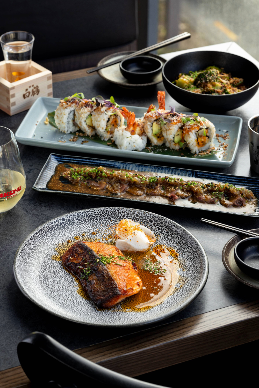 Kome's salmon fillet, beef tataki and ebi mayo roll. Photo / Babiche Martens