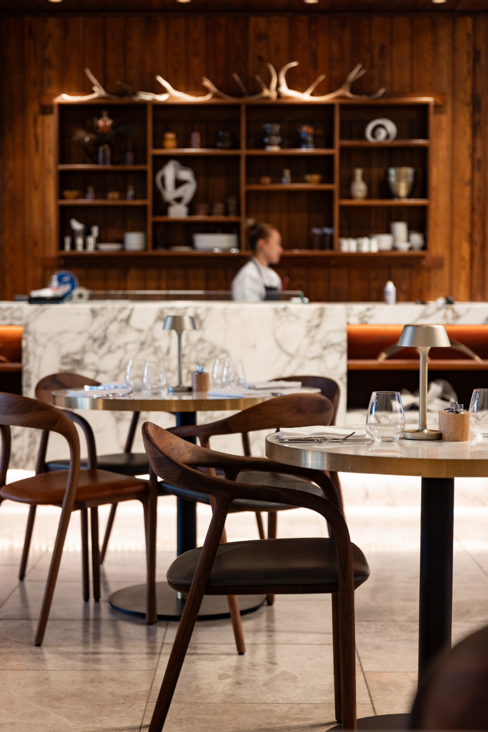 Each table has a little lamp that casts light over your menus. Photo / Babiche Martens