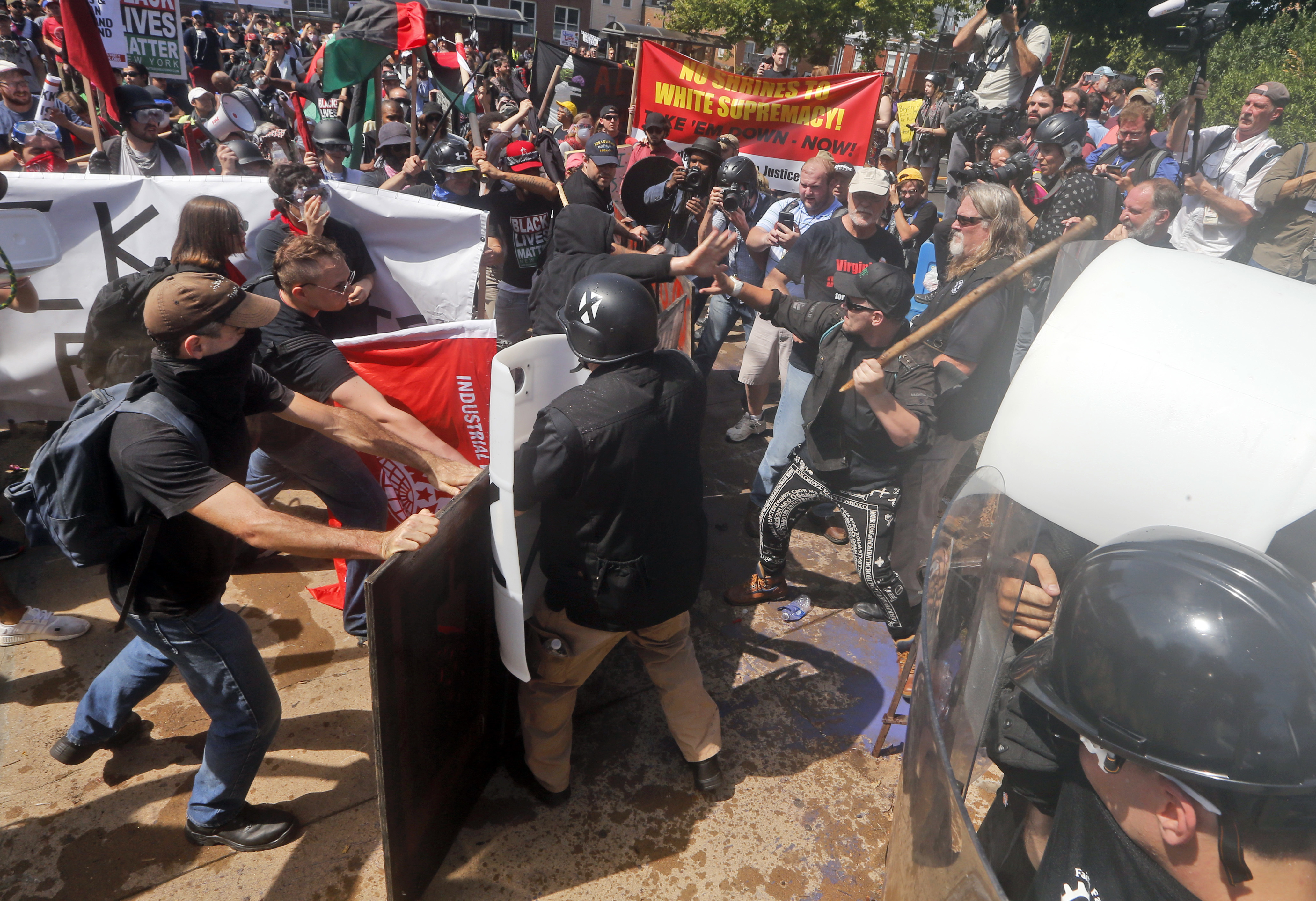 White nationalist demonstrators clash with counter demonstrators at the entrance to Lee Park in Charlottesville. Photo/AP