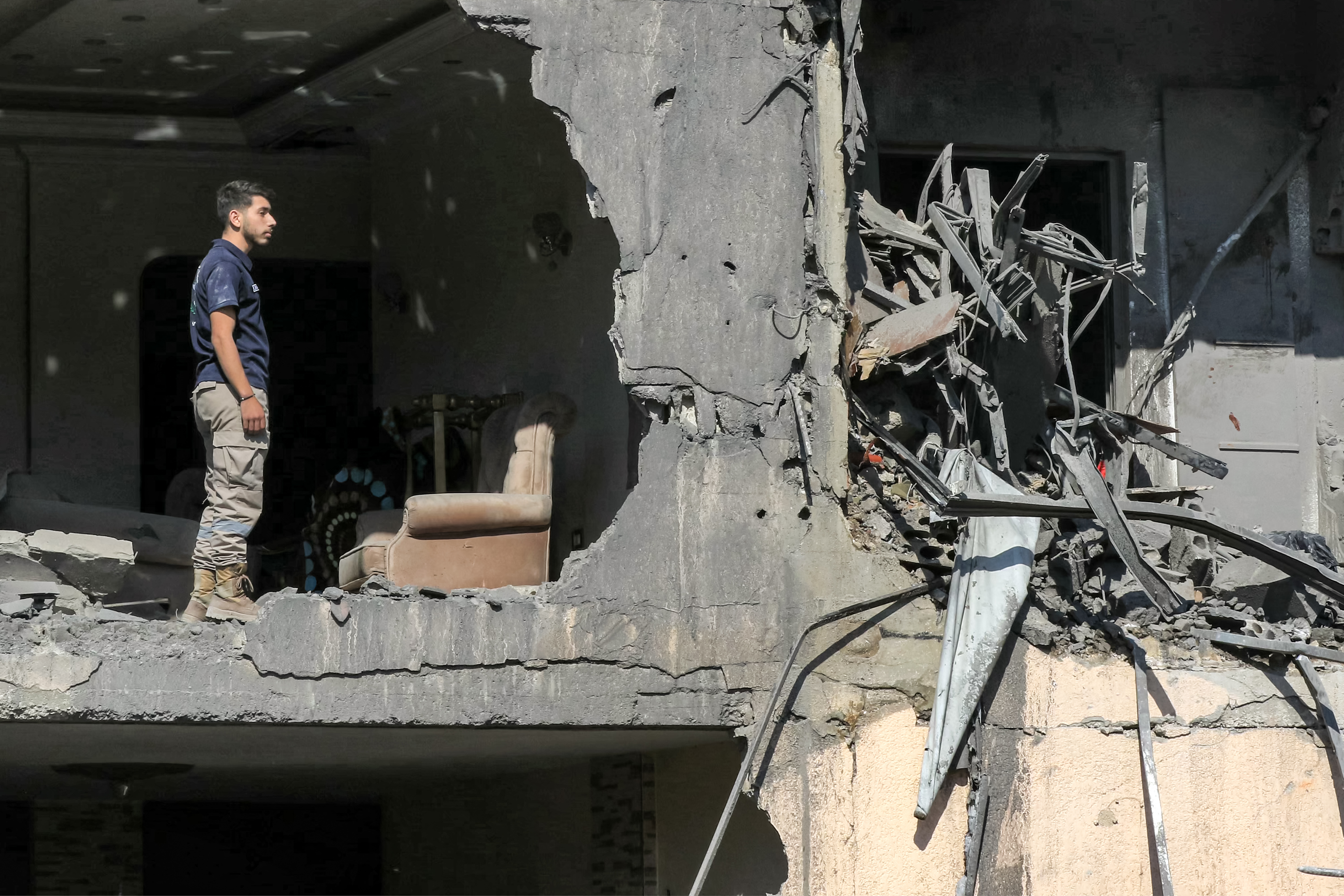 A man stands in a heavily-damaged building that was hit by an overnight Israeli air strike on town of Sarafand, between Sidon and Tyre in southern Lebanon, on October 30. Photo / AFP