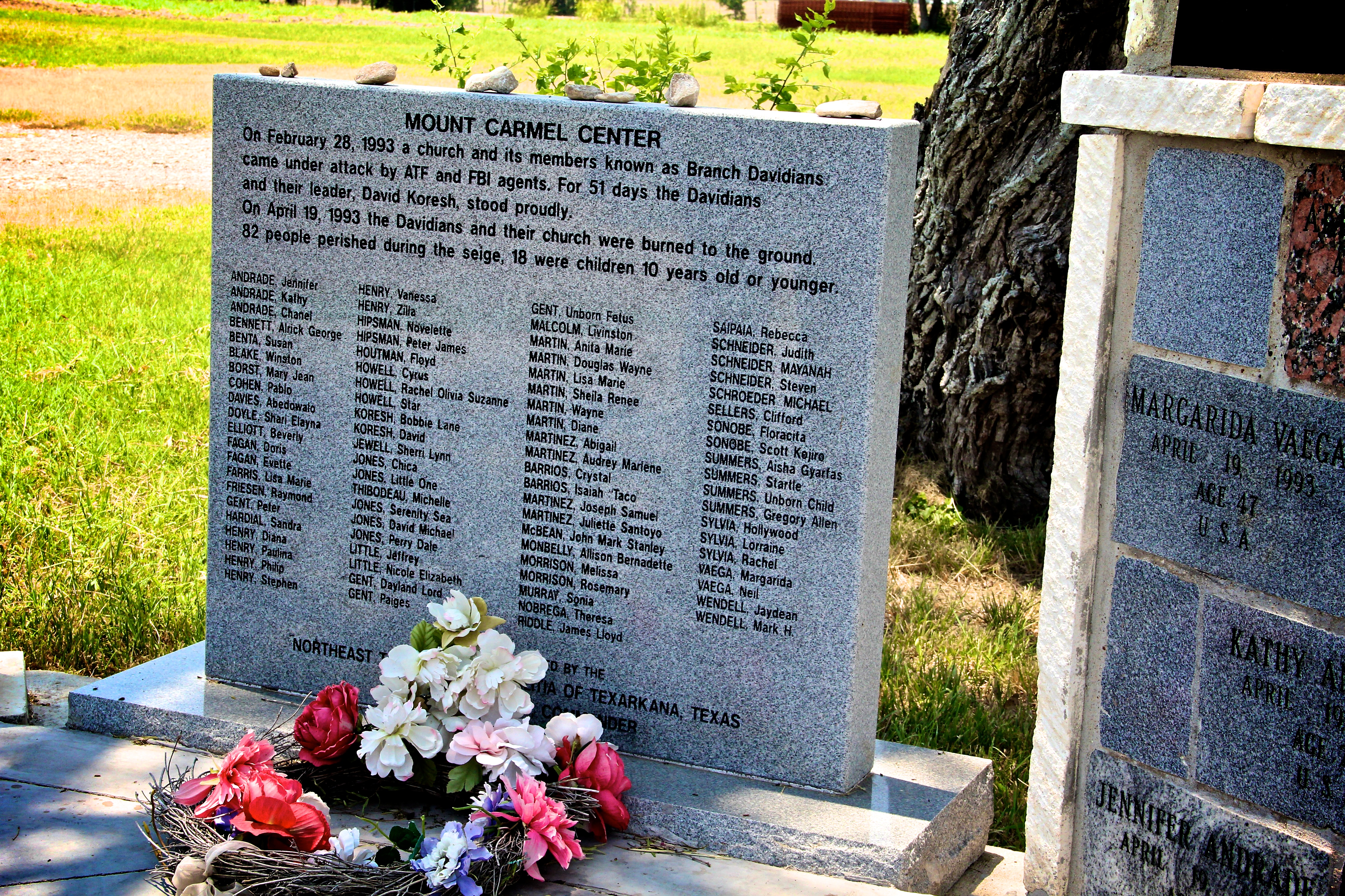 A headstone with the names of the 82 church members who died following the 51-day standoff with ATF and FBI agents. Photo / Getty