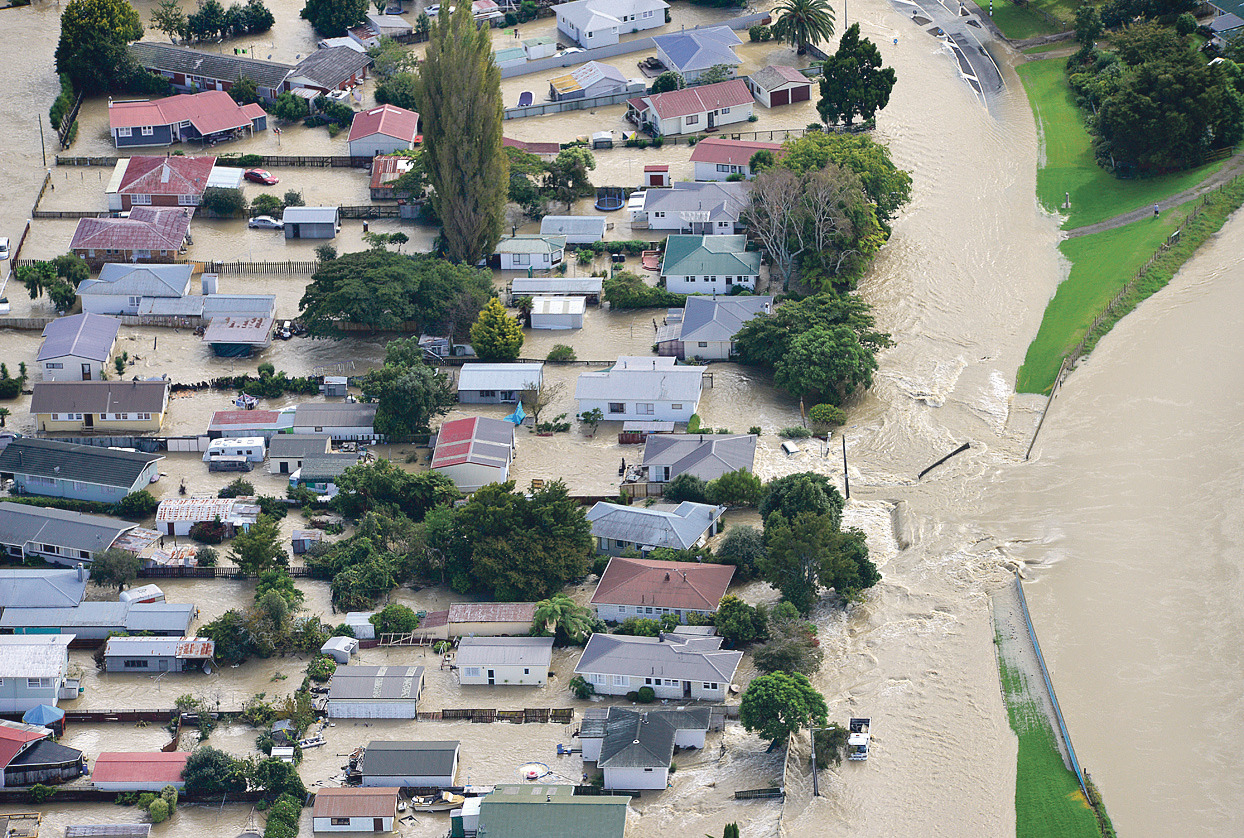 Water flows into Edgecumbe through a breach in the Rangitaiki River stopbank on April 6, 2017. Photo / Whakatane Beacon