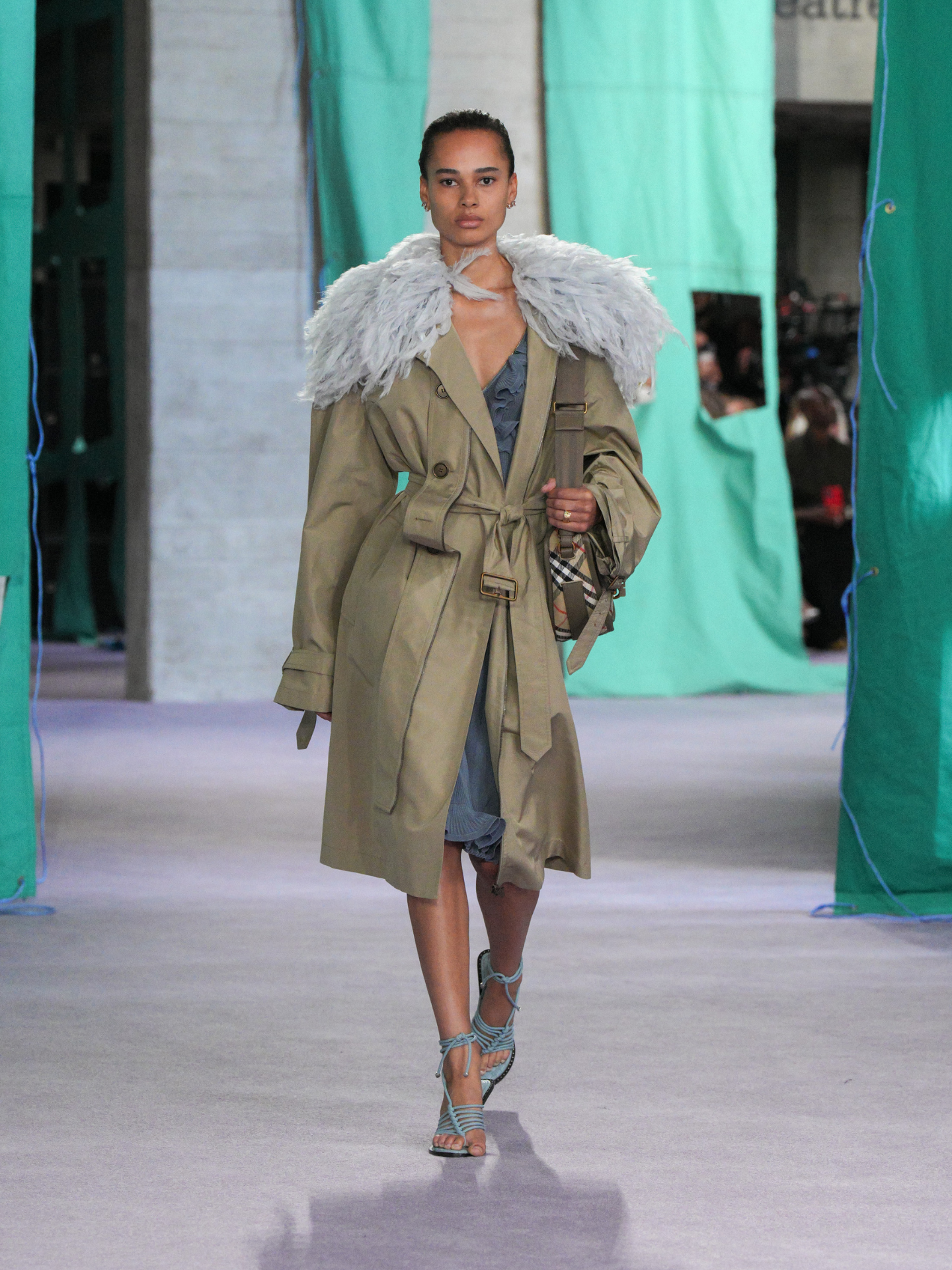 The transeasonal fourth look included a reimagined trench coat with a tartan bag.