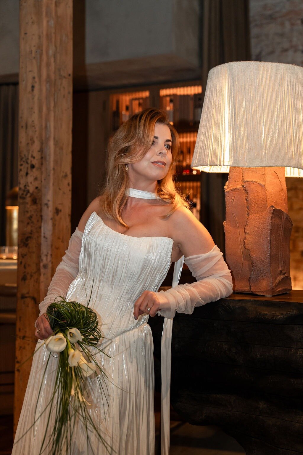Anna wears the Rouge set: 'The trailing ties and subtle neck drape frame her like a living sculpture, serene, powerful, divine.' Photo / Supplied
