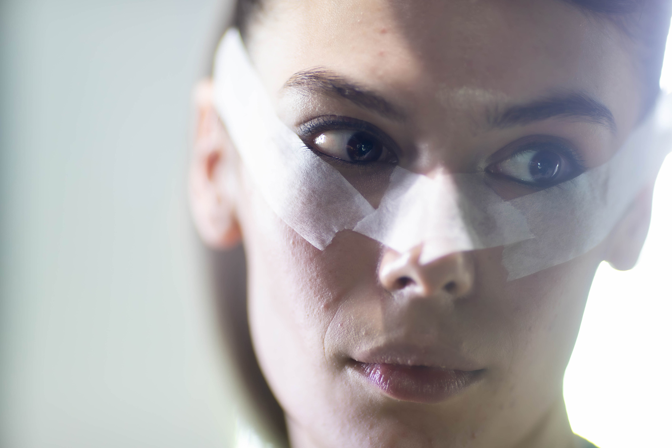 12.37pm: A makeup artist applies tape to Hope Phillips' face, before adding colour. Photo / Michael Craig