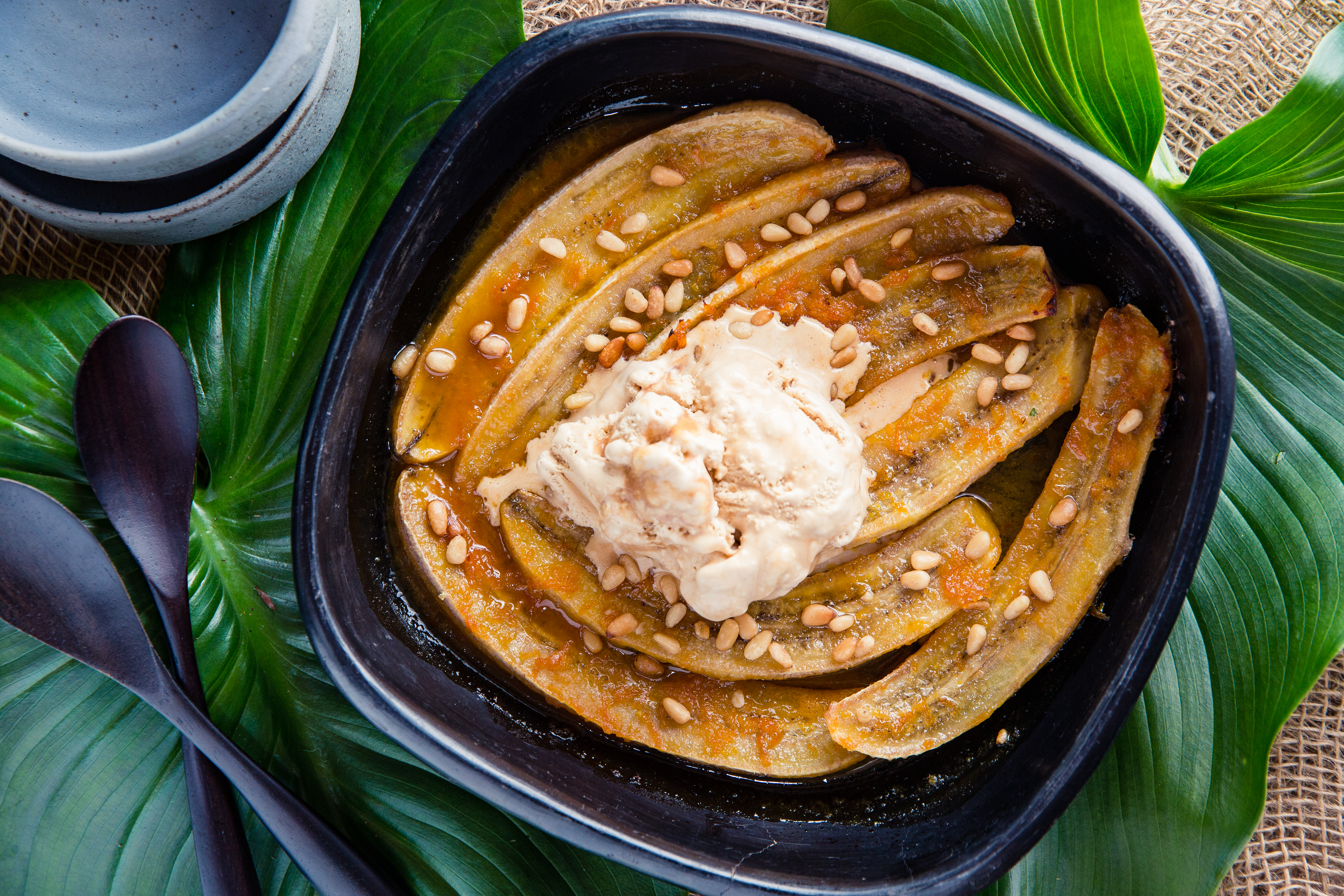 Serve these baked bananas with a good scoop of icecream. Photo / Babiche Martens