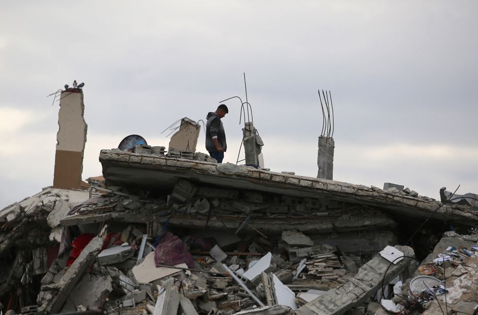 A displaced Palestinian man inspects the damage to his home in Gaza City. Photo / AFP