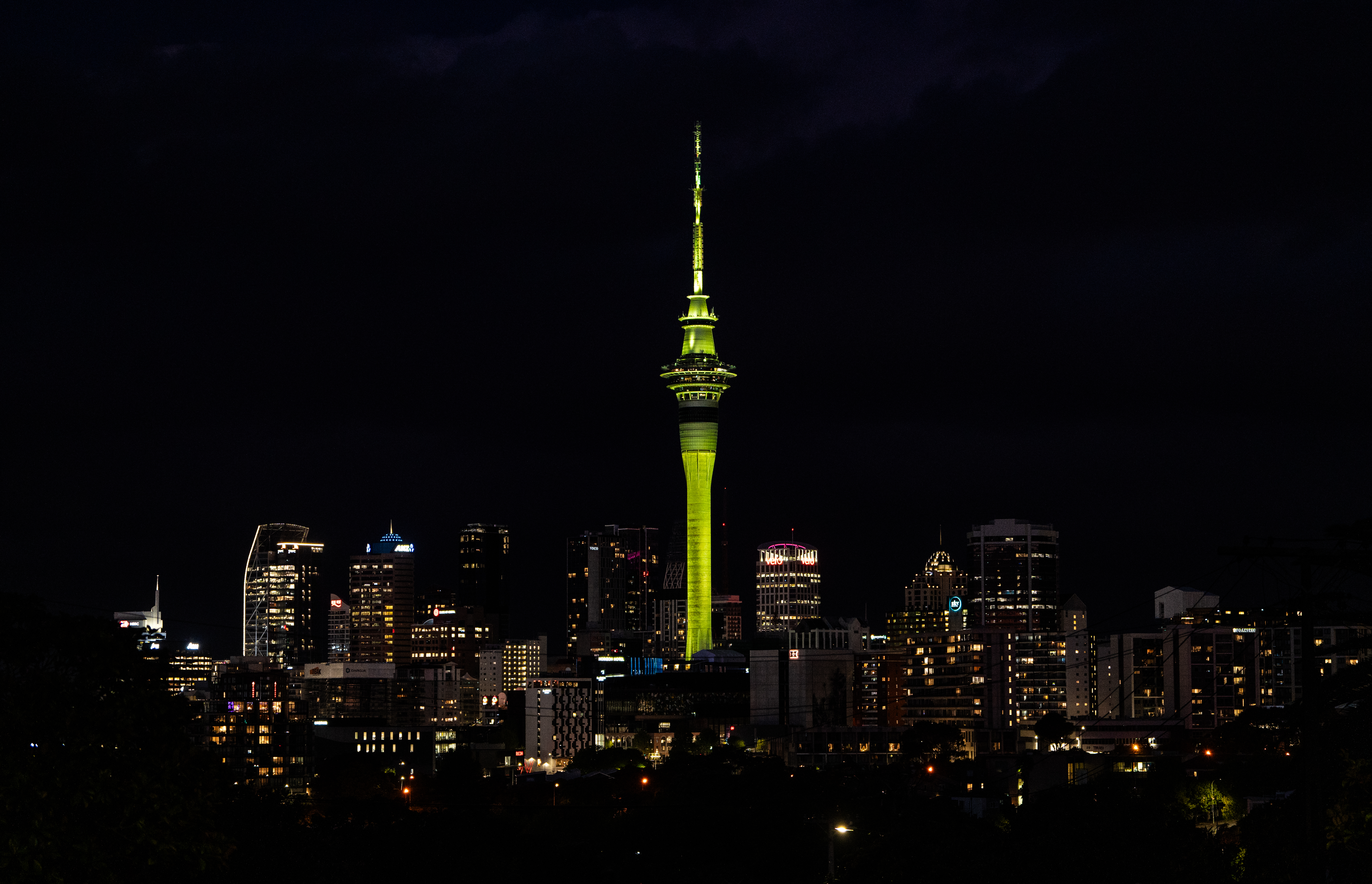 Brat-green Skytower lights up in honour of the Laneway Festival 2025 announcement that Charli XCX will headline the festival. Photo / Ben Dickens