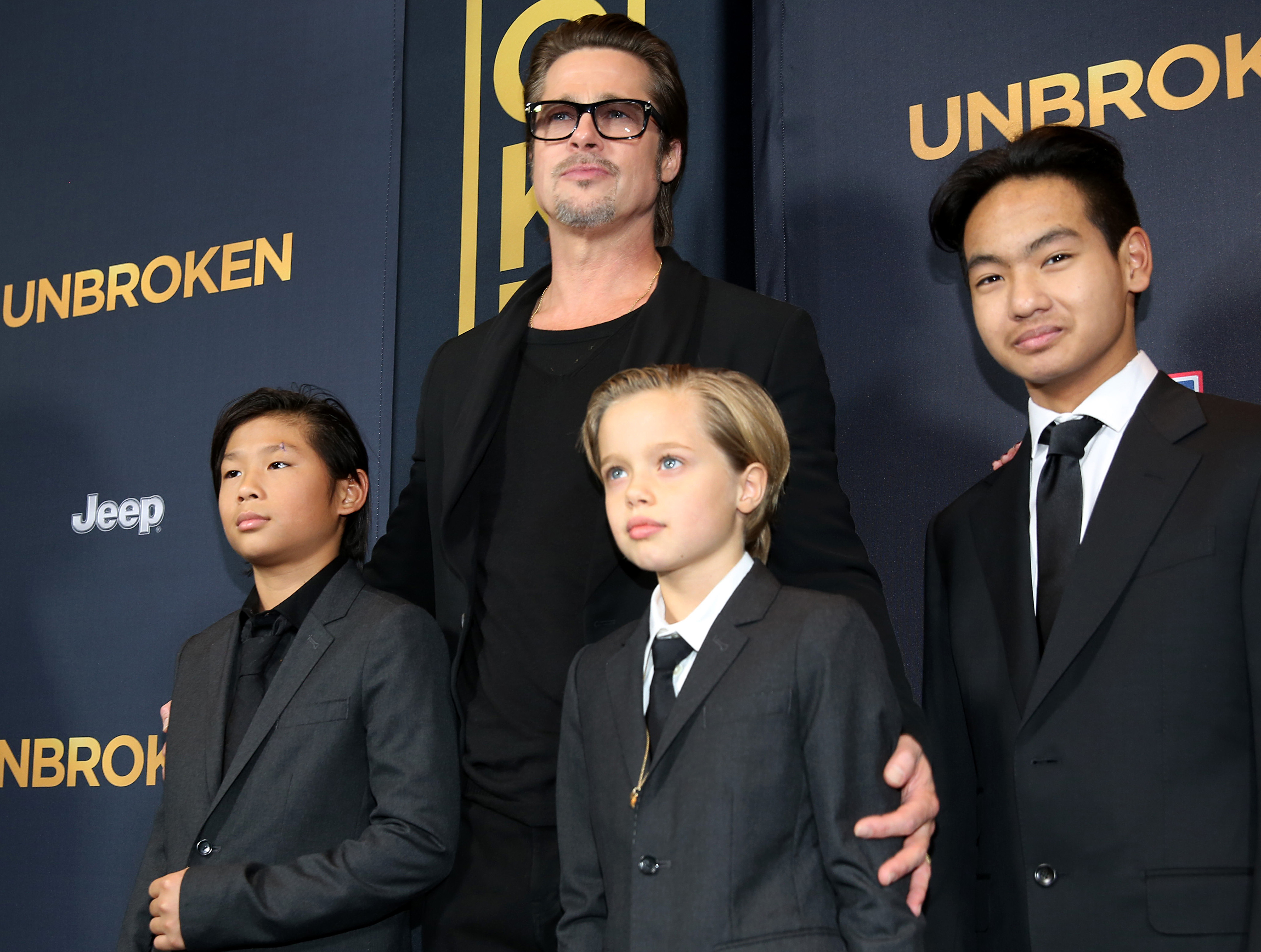 Brad Pitt with children (from left) Pax, Shiloh and Maddox Jolie-Pitt in 2014. Photo / AP