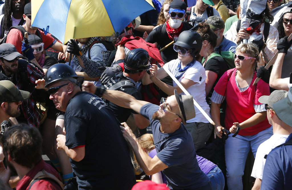 White nationalist demonstrators clash with counter demonstrators at the entrance to Lee Park in Charlottesville, Virginia. Photo / AP