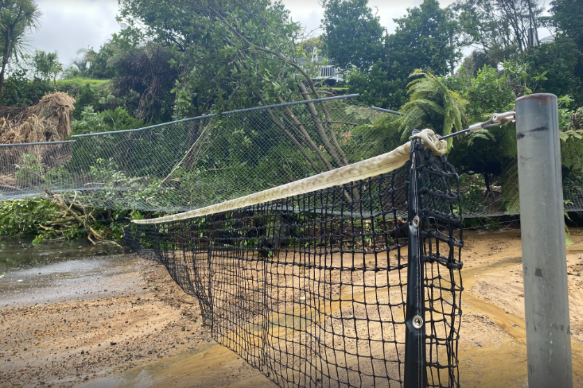 Clean-up efforts are underway at Northcote Bowling Club at Little Shoal Bay Reserve in Northcote Point. There’s no immediate fix to the adjoining tennis court, which was covered by a slip. Photo / Craig Kapitan
