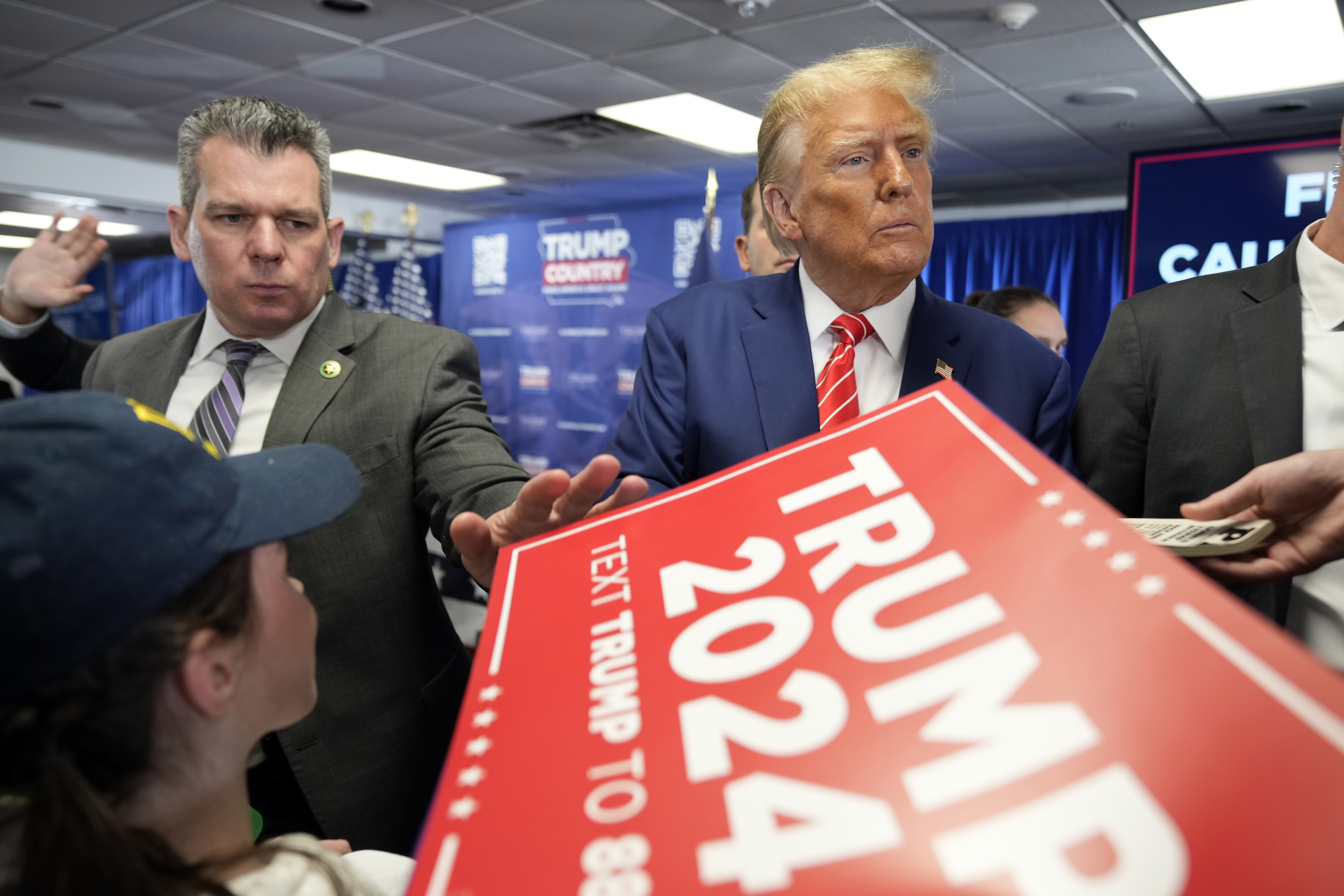 Republican presidential candidate former President Donald Trump signs autographs after speaking at a rally at Des Moines Area Community College in Newton, Iowa. Photo / AP