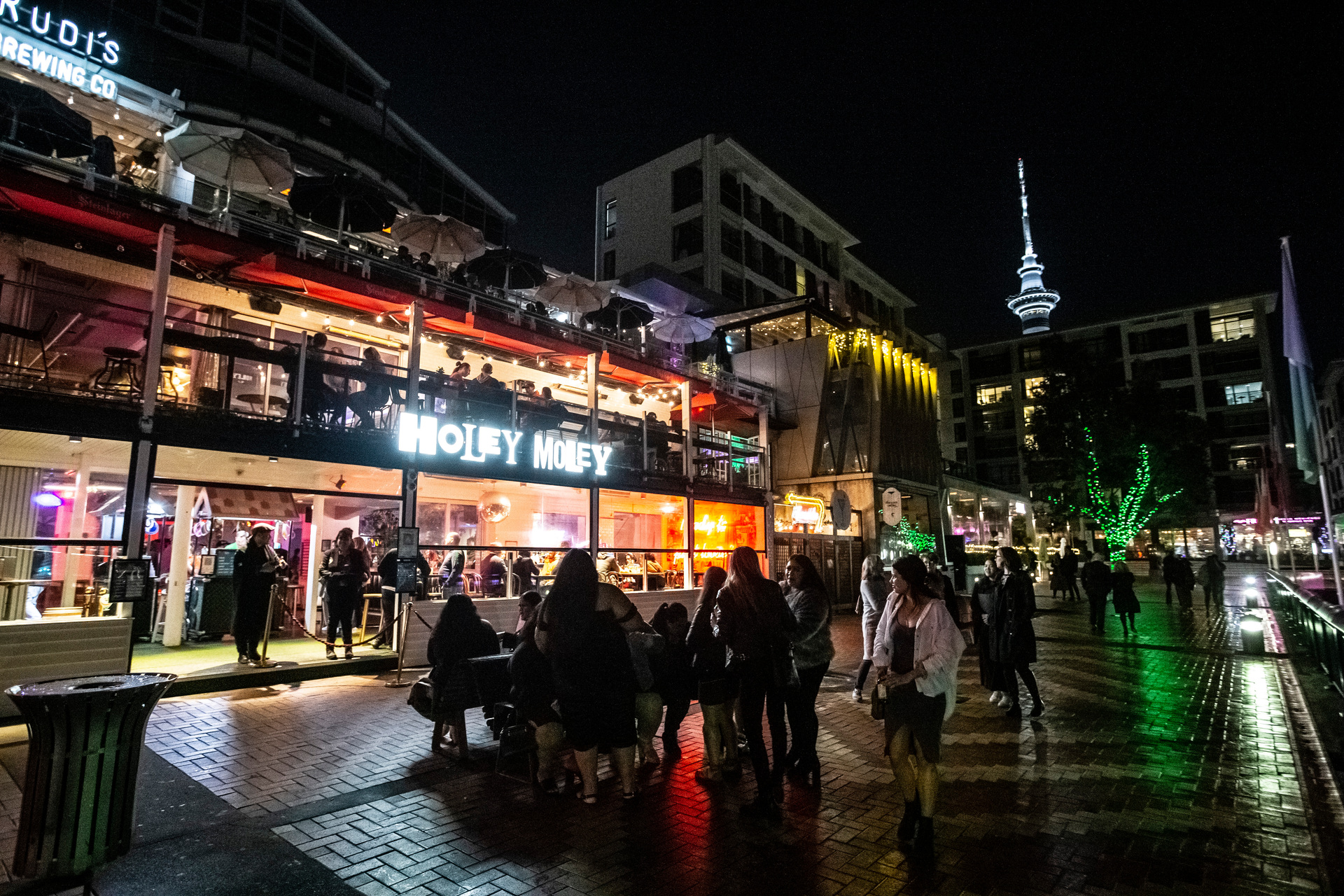 Downtown Auckland is a magnet for nightlife seekers, including these revellers enjoying a cool night out in July 2021. Photo / Greg Bowker 