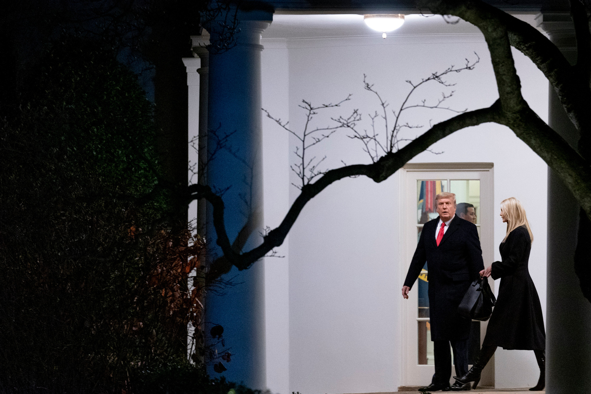 President Donald Trump, accompanied by Ivanka Trump, right, walks out of the Oval Office. Photo / AP