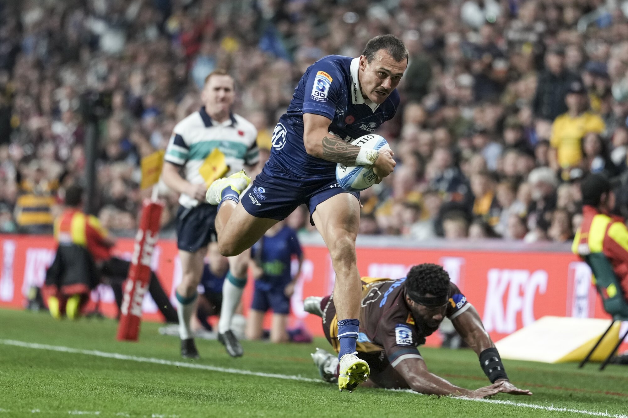 Blues winger Cole Forbes heads to the tryline against the Reds in Christchurch. Photo / SmartFrame
