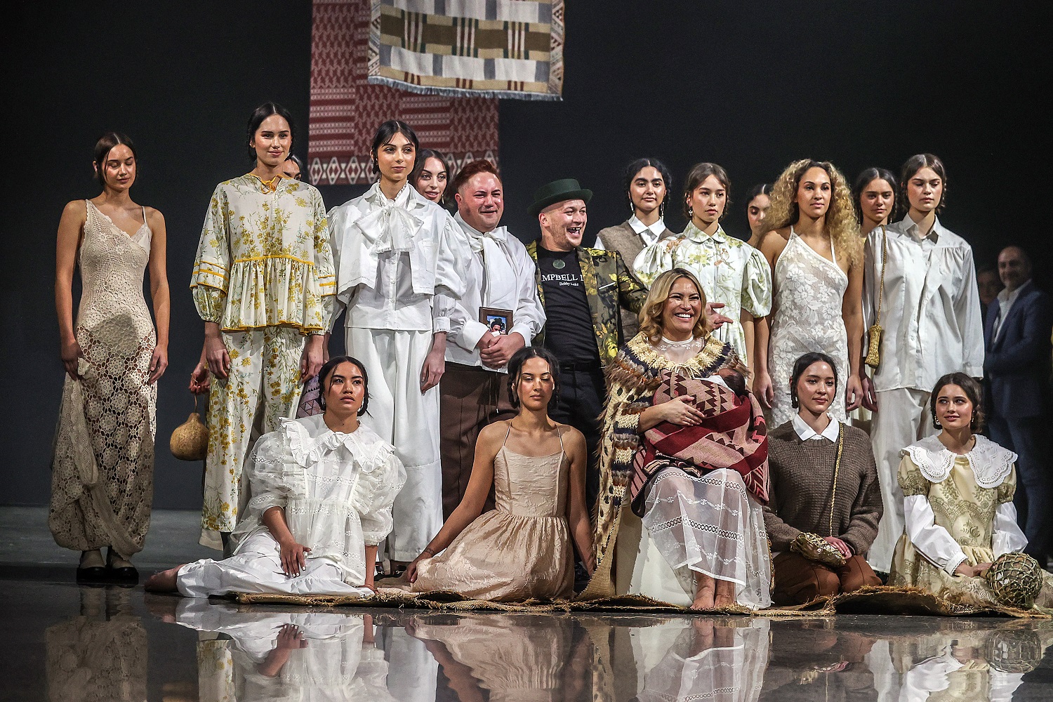 Dr. Bobby Campbell Luke and Dominic Blake join their models and Kai-ora Tipene and her baby after the Campbell Luke show. Photo by Fiona Goodall, Getty Images.