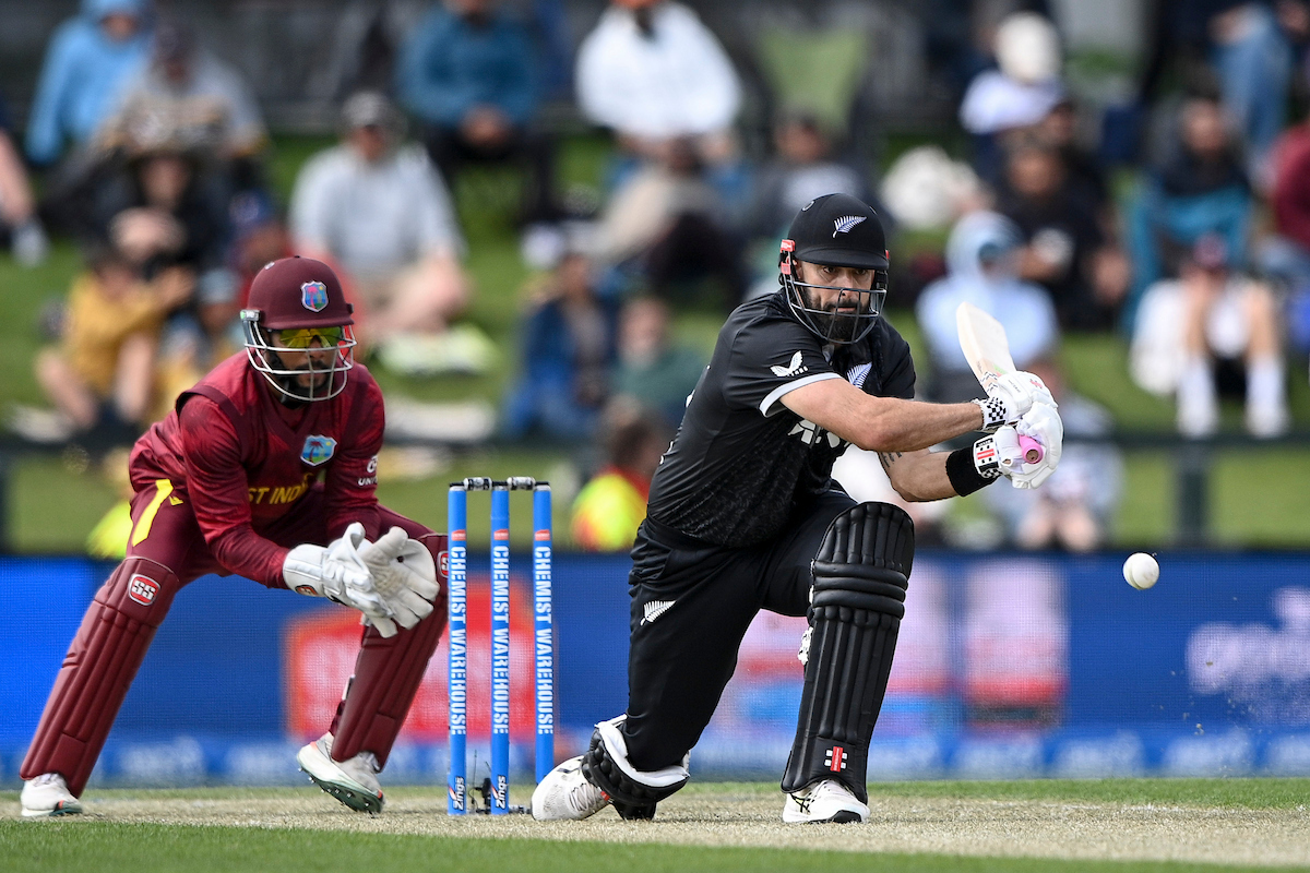 Daryl Mitchell reverse sweeps against the West Indies in Christchurch. Photo / Photosport