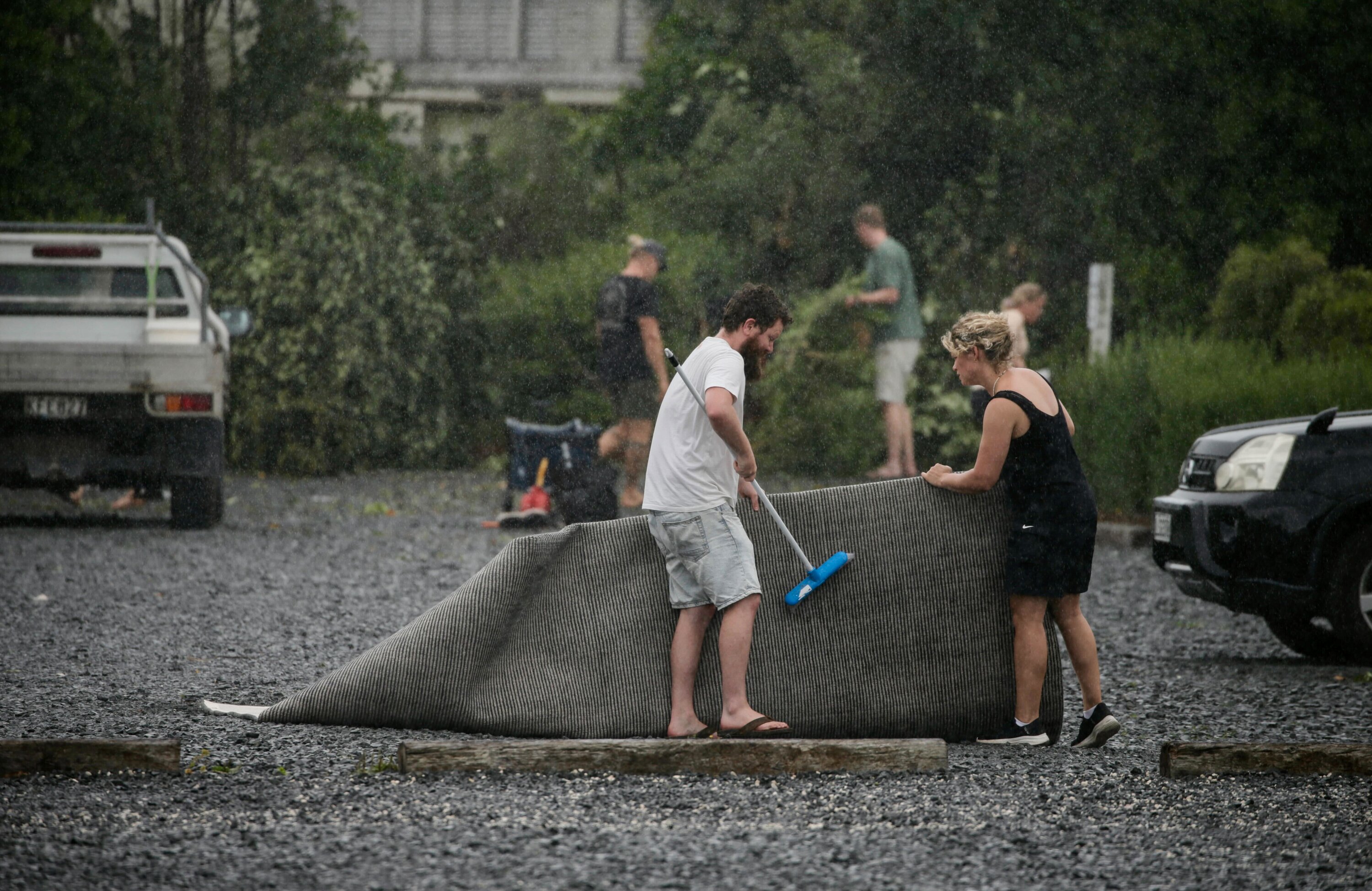 Residents clean up after a tornado swept through Mangawhai in the early hours of Sunday morning. Photo / Alex Burton 