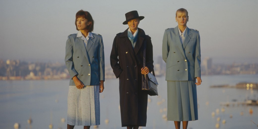 Dressed to impress: female flight attendants certainly embraced the eighties trends with structured jackets and jaunty hats. Photo / Air New Zealand