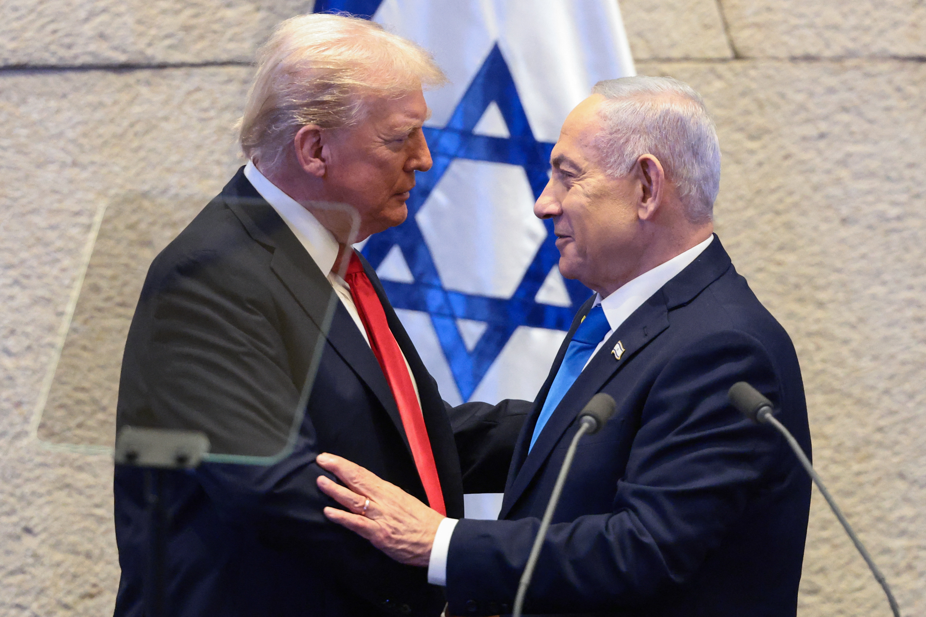 US President Donald Trump speaks with Israeli Prime Minister Benjamin Netanyahu at the Israeli parliament, the Knesset, in Jerusalem. Photo / Evelyn Hockstein, POOL, AFP