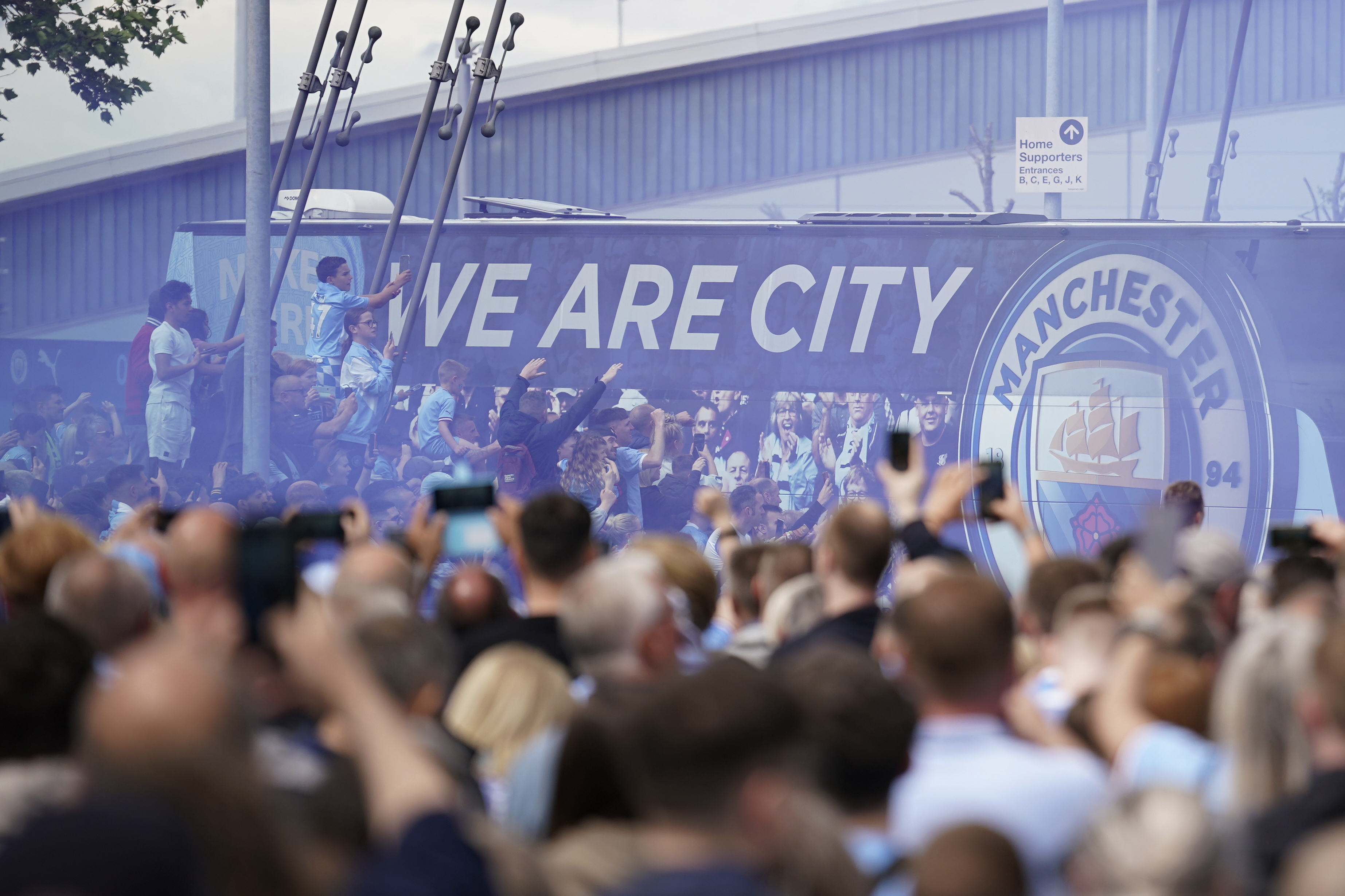 Fans welcome Manchester City players before the start of an English Premier League match at the Etihad Stadium. Photo / AP