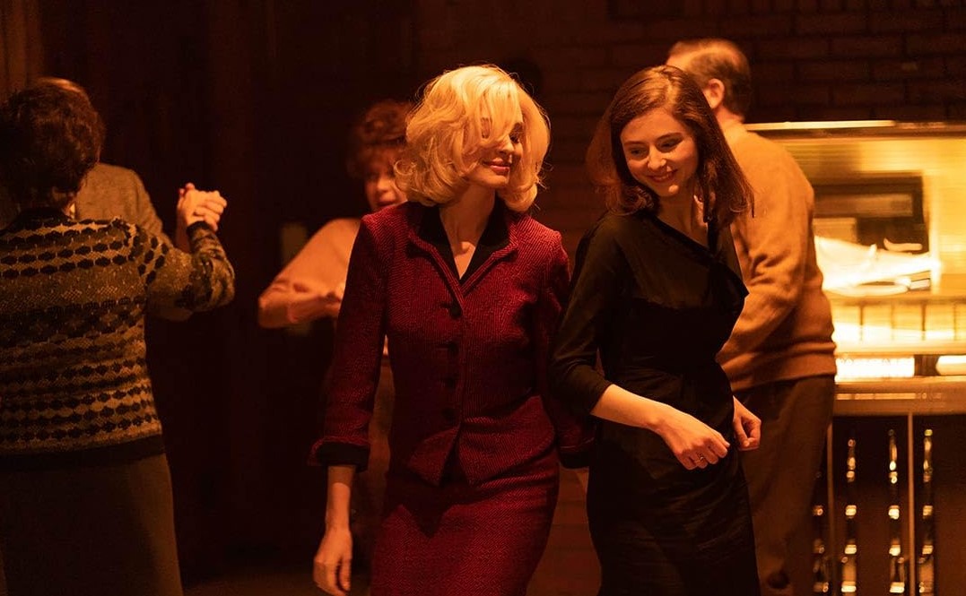 Thomasin McKenzie, right, with Anne Hathaway in Eileen.