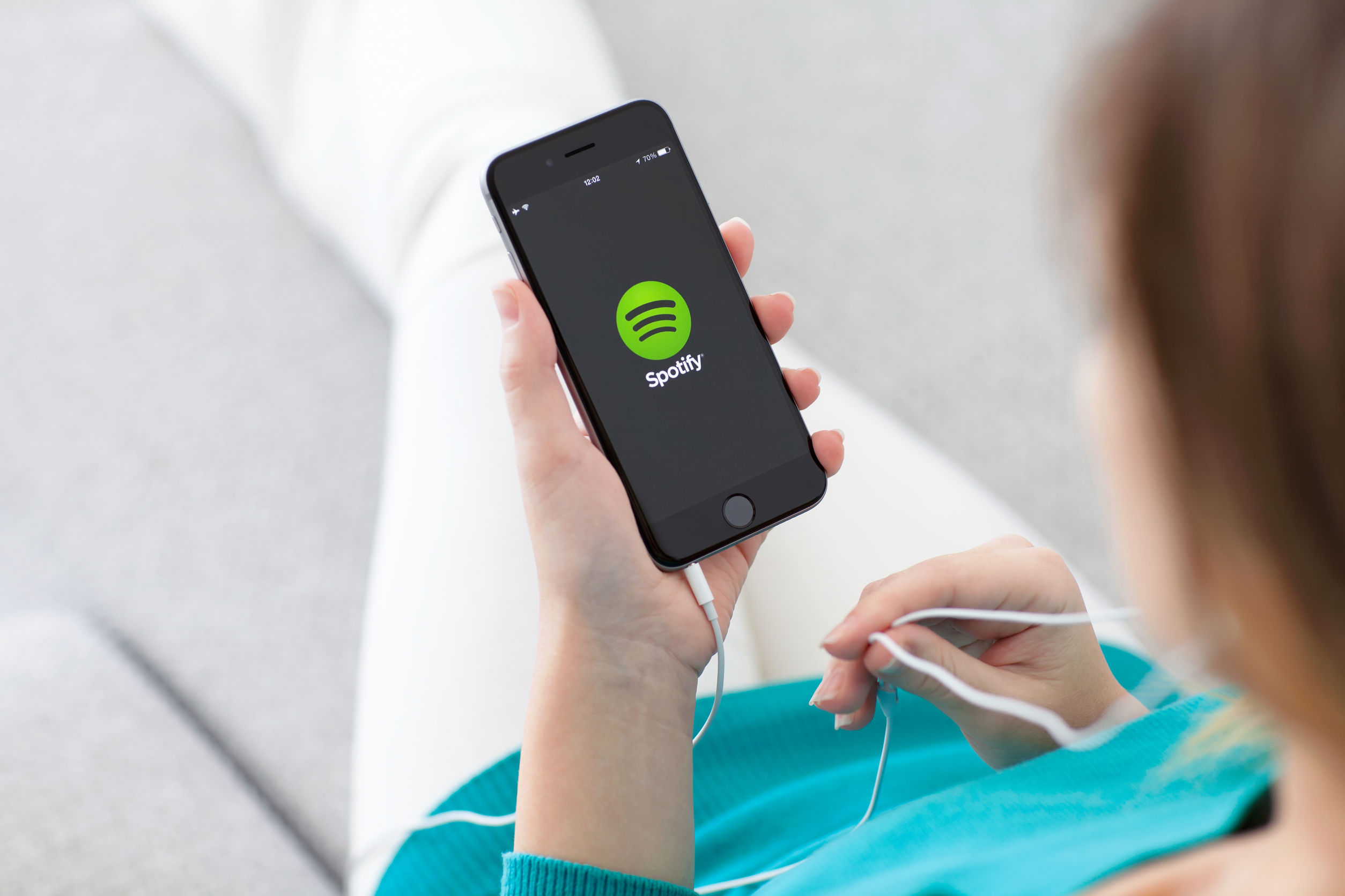 Spotify is tiptoeing into the podcast field currently dominated by Apple. Photo / 123RF
