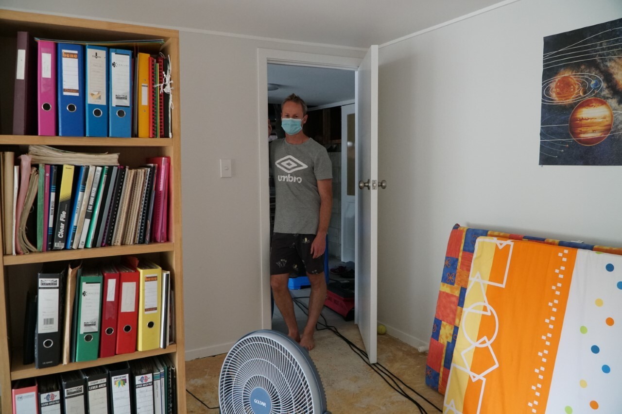 Rotorua resident Chris Parnell, who is currently isolation, surveys a room his family are trying to dry out. Photo / Supplied