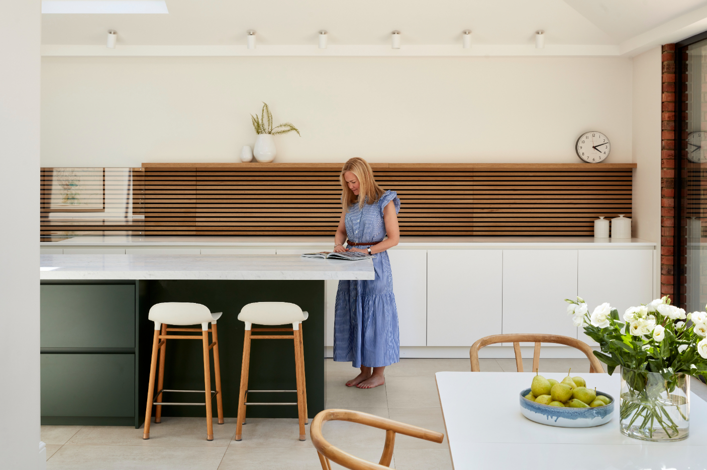 The kitchen features a combination of soothing natural tones.