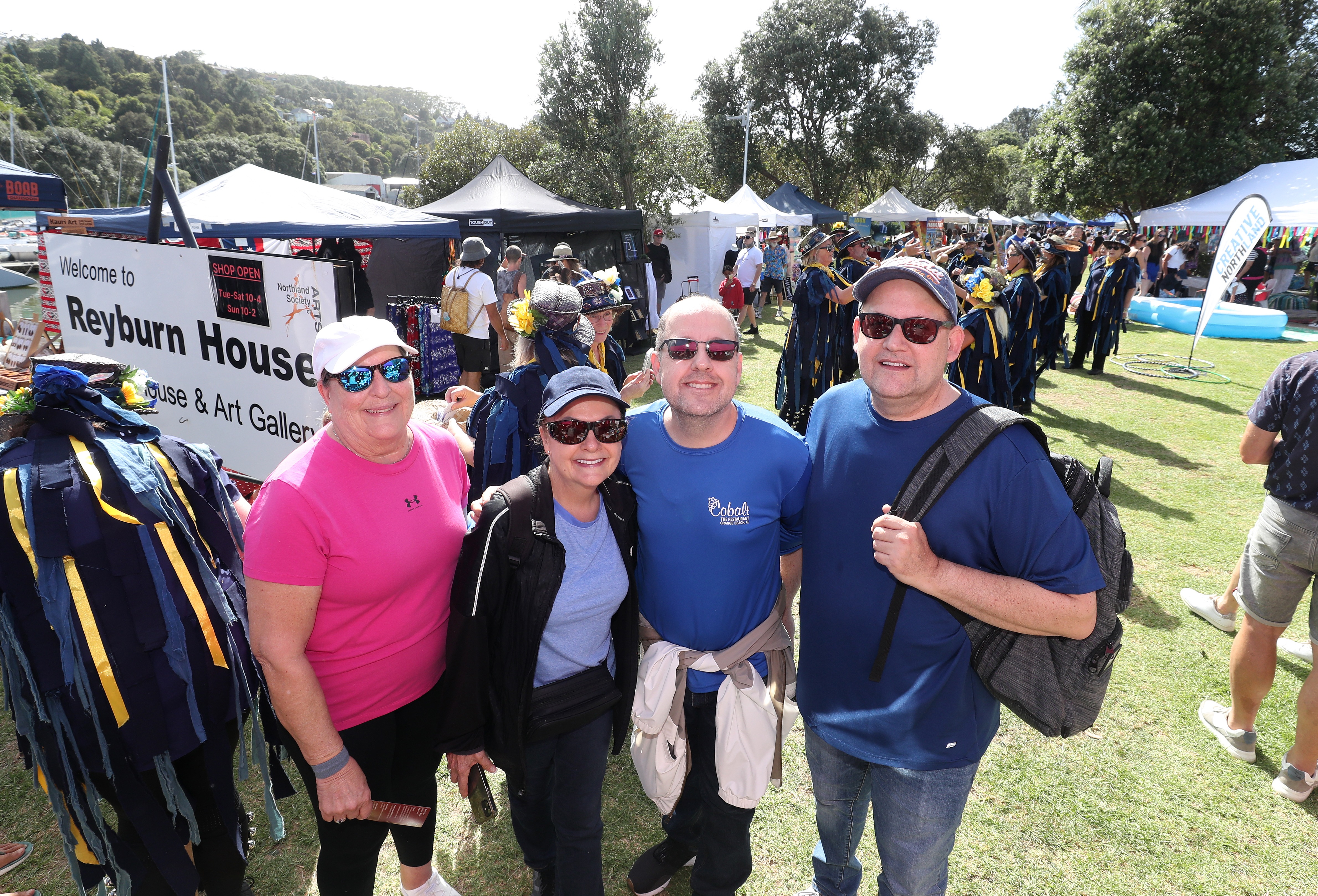 Passengers from the ship from are Susan Curry (left), Monika Jones-Lyons, Anthony Jones and Dennis Jones enjoying the market at Town Basin. Photo / Michael Cunningham