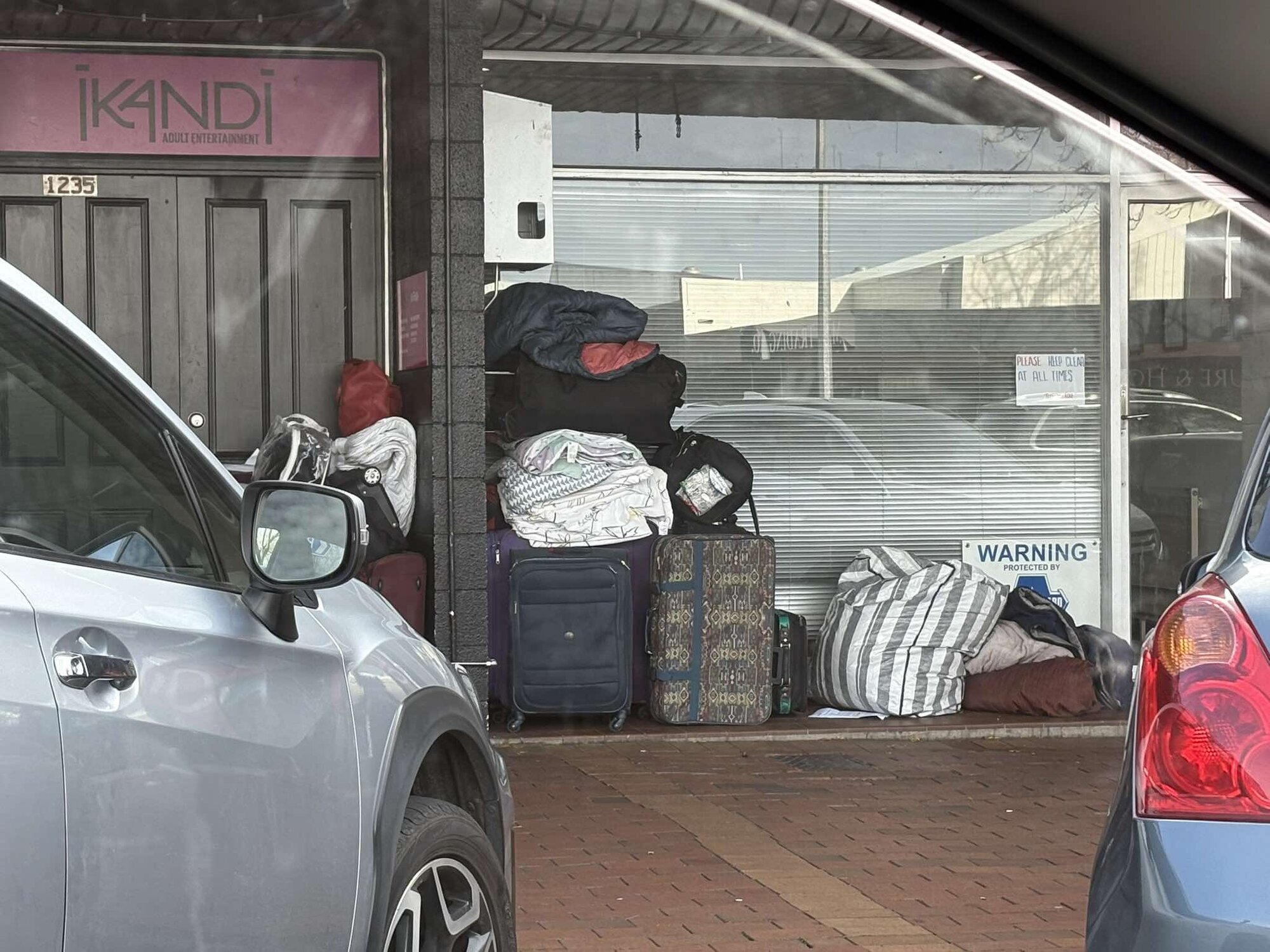  The suitcases stacked up outside Pukuatua St businesses. Photo / Supplied