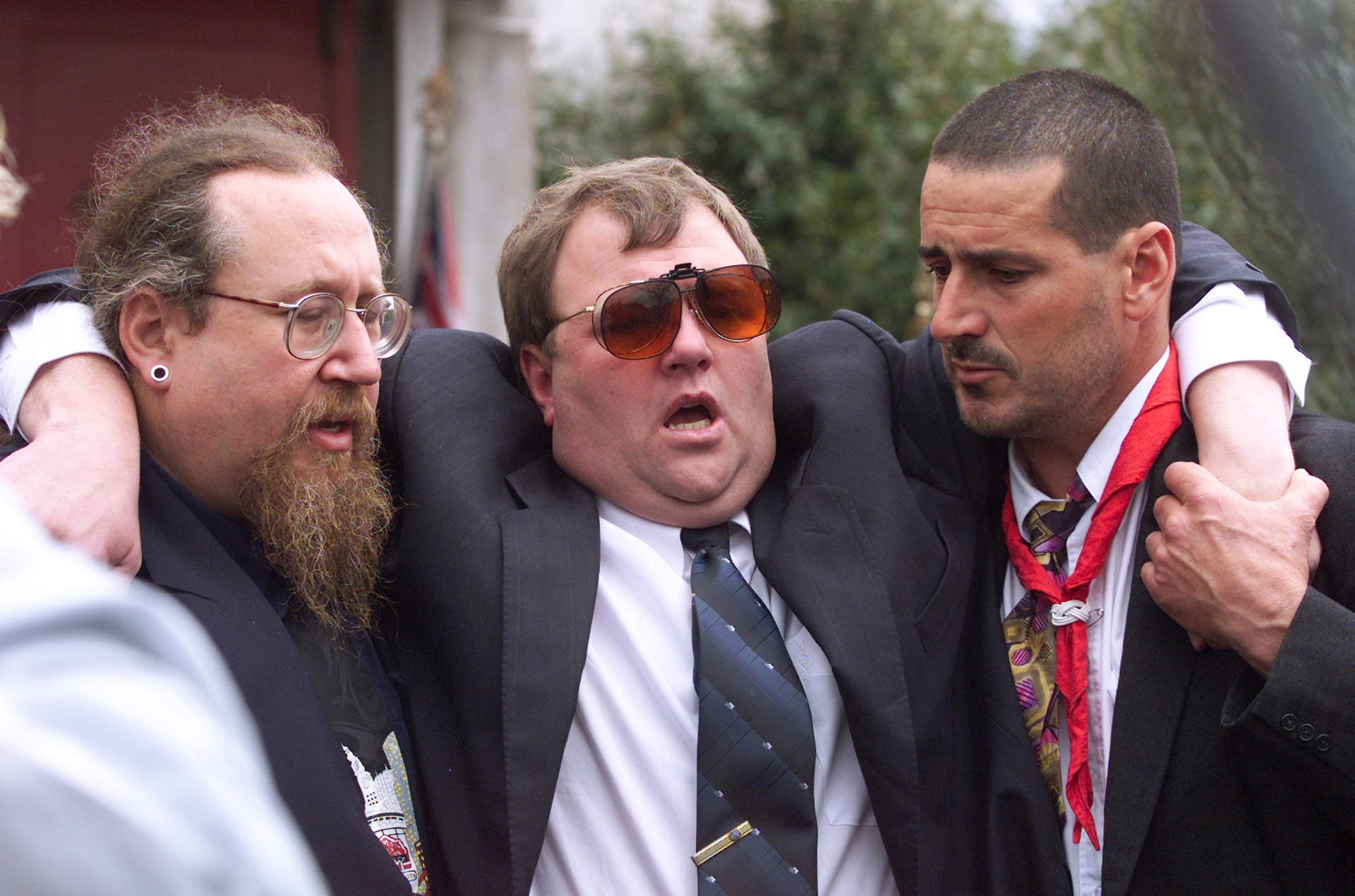 Mark Lundy supported after the funeral of his wife Christine and daughter Amber in 2000. Photo / Mark Mitchell