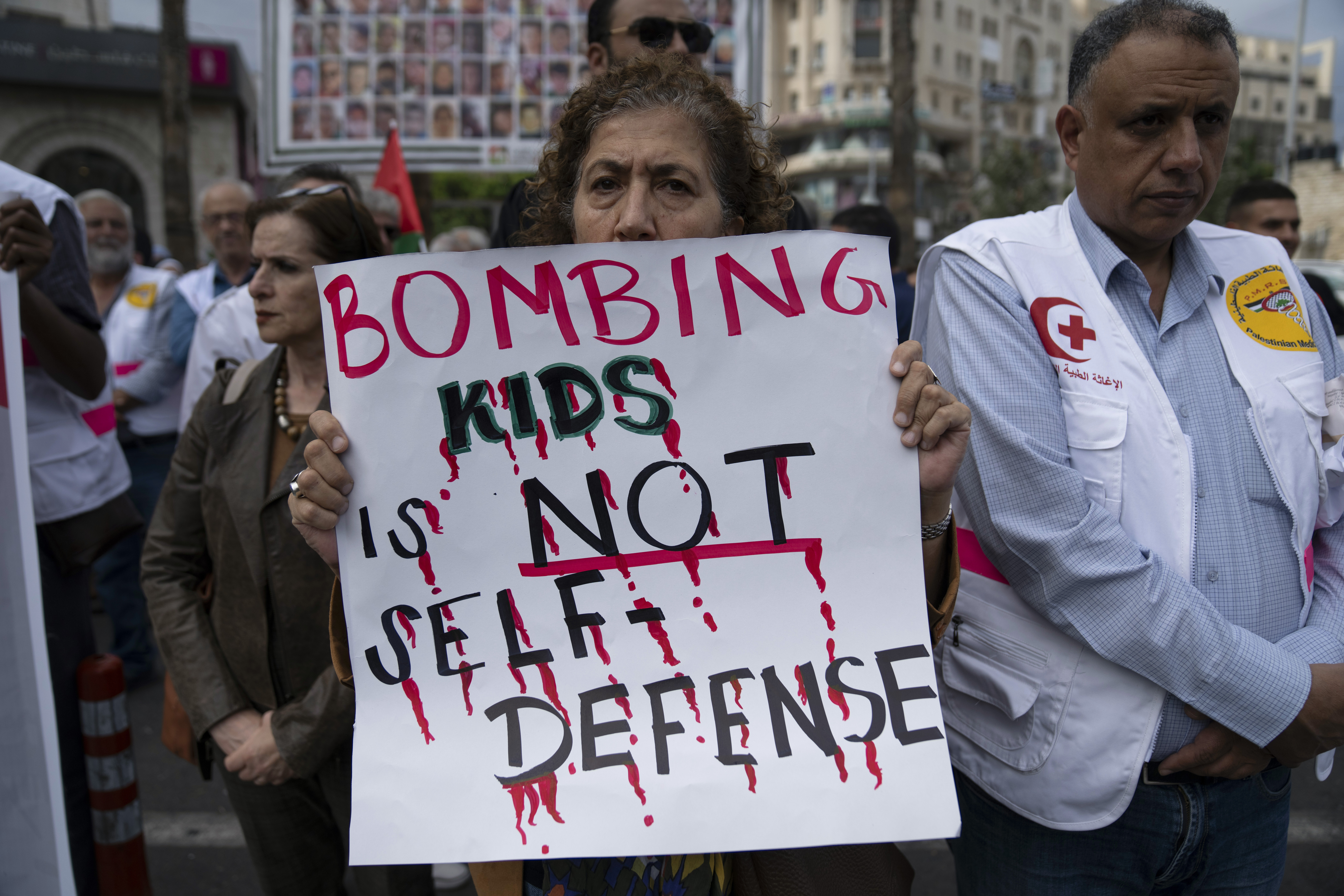 Members of the Palestinian health sector take part in a rally to protest the collapse of the Palestinian health services in Gaza, in the West Bank city of Ramallah. Photo / AP