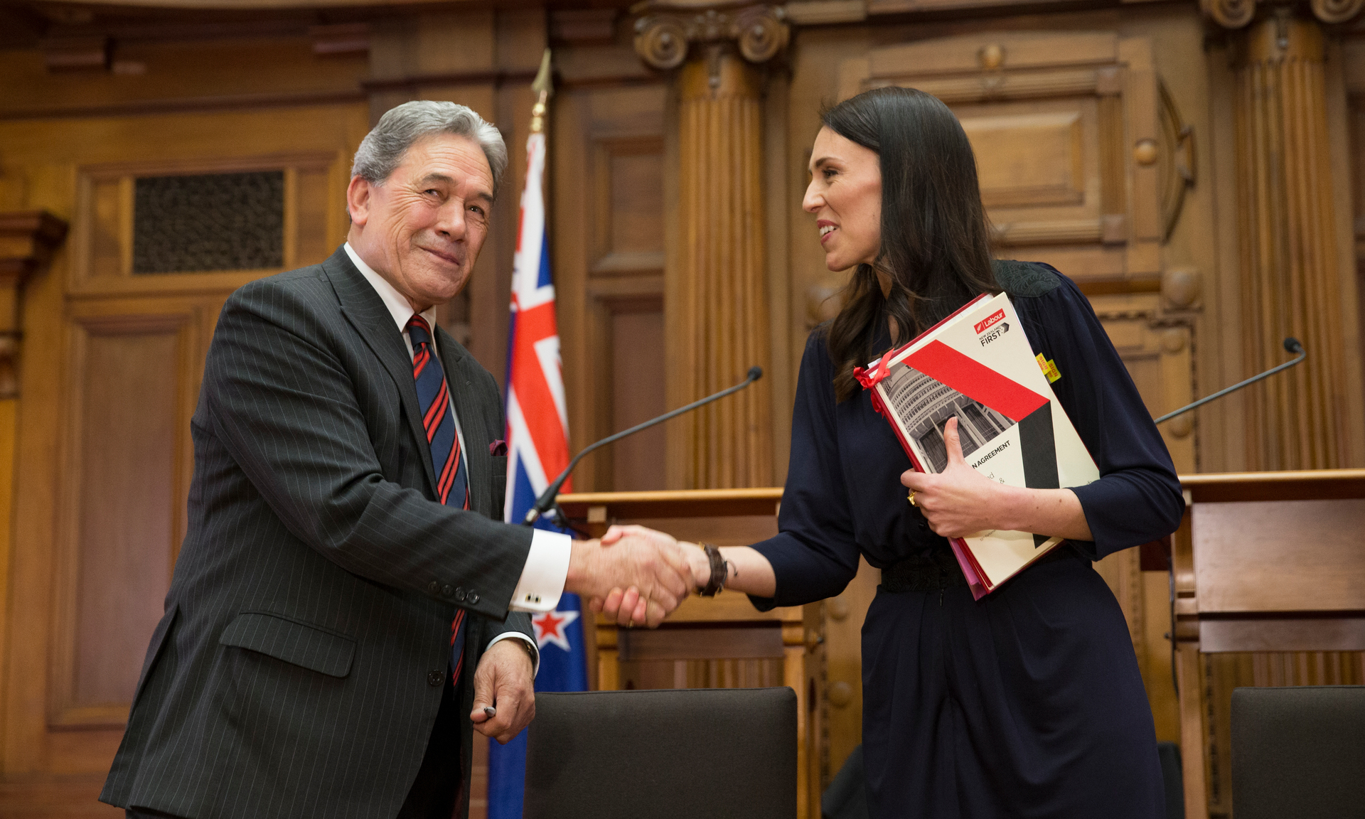 Winston Peters and Jacinda Ardern shaking hands after signing their coalition agreement. Photo / Mark Mitchell