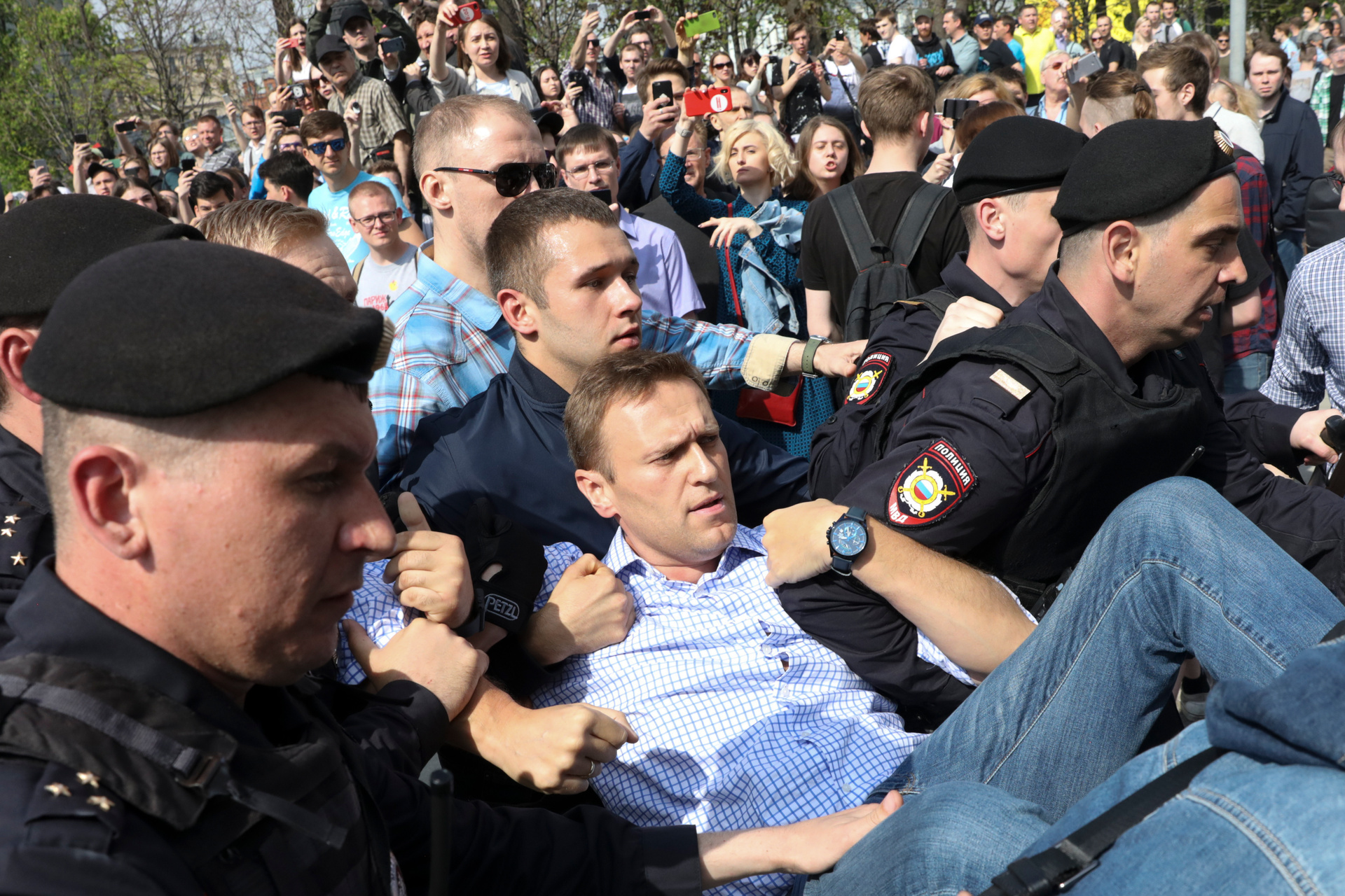 Russian police carry opposition leader Alexei Navalny, center, from a demonstration against President Vladimir Putin in Pushkin Square in Moscow, Russia in 2018. Photo / AP