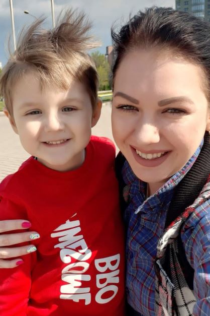 This pre-war photo provided by the family shows 5-year-old Artem Erashov, with his mother, Lydya. The boy and his 7-year-old cousin, Angelina, were killed during Russian shelling on March 9. The families of the young cousins returned to occupied Mariupol to rebury their children in the Staryi Krym cemetery, now the site of thousands of new graves since the Russian invasion began Feb. 24.  Photo / via AP
