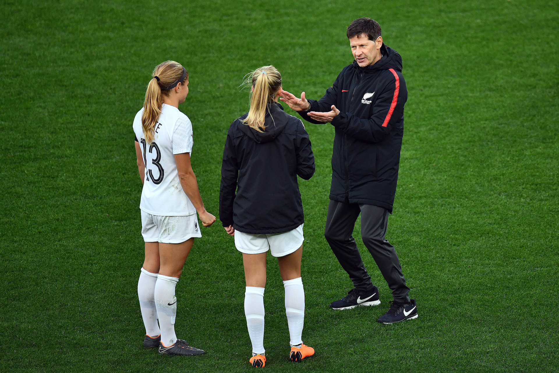 Former Football Ferns' coach Andreas Heraf speaking with Rosie White and Katie Bowen in 2018. Photo / Photosport