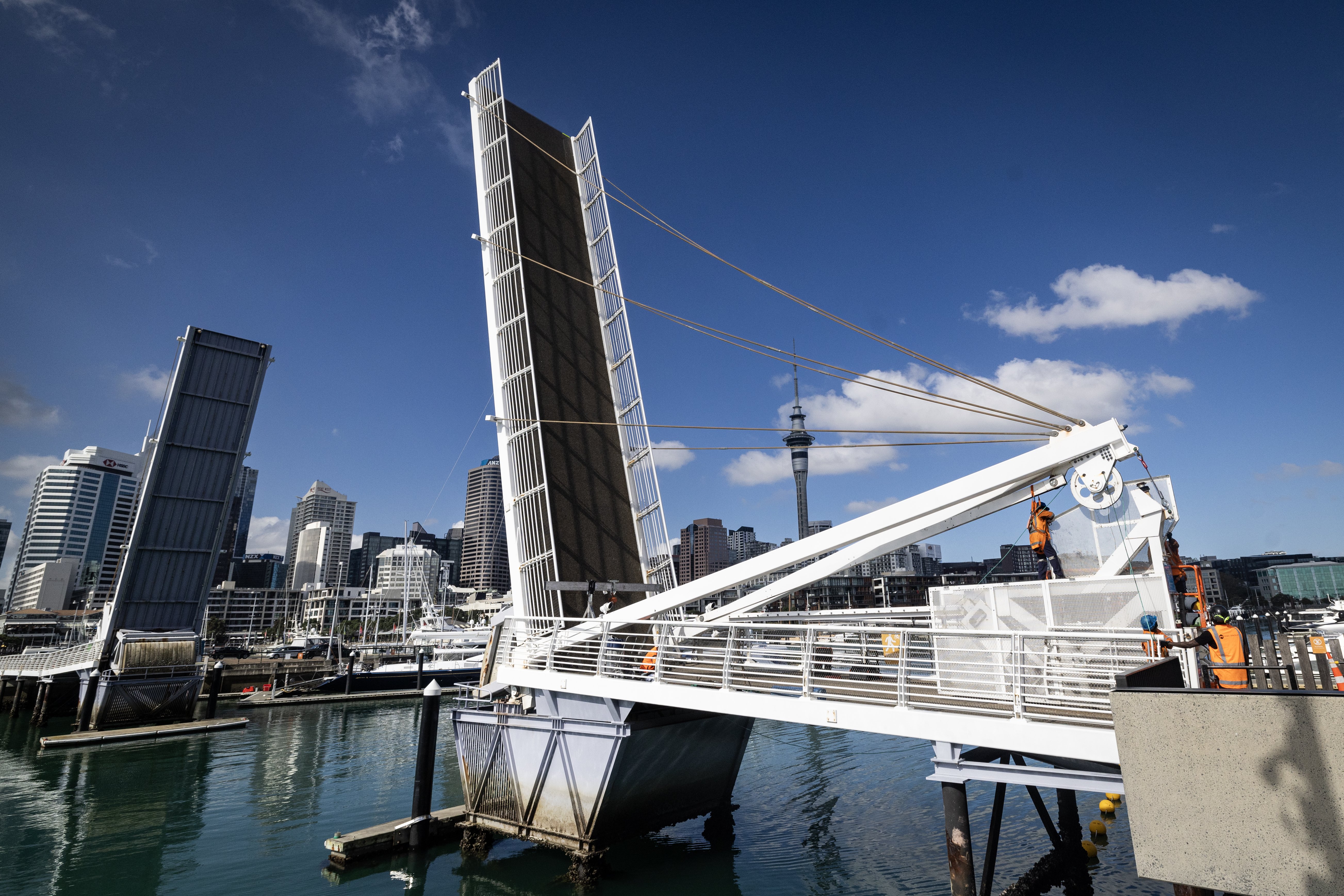 Work is under way on repairs to the Wynyard Quarter footbridge - but it may not reopen until December. Photo / Jason Oxenham 