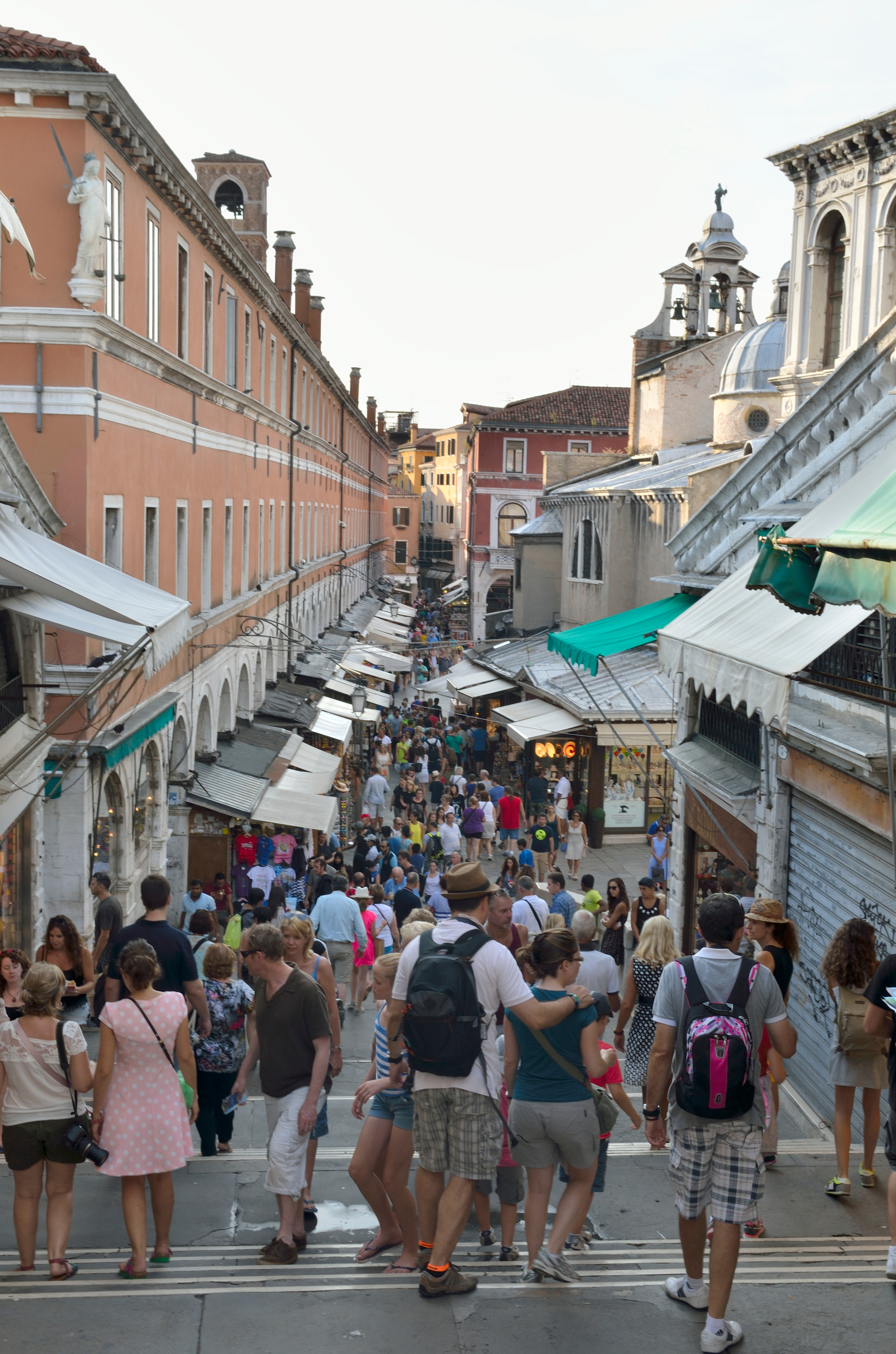 Tourists roam the streets of the Rialto market. Photo / 123rf