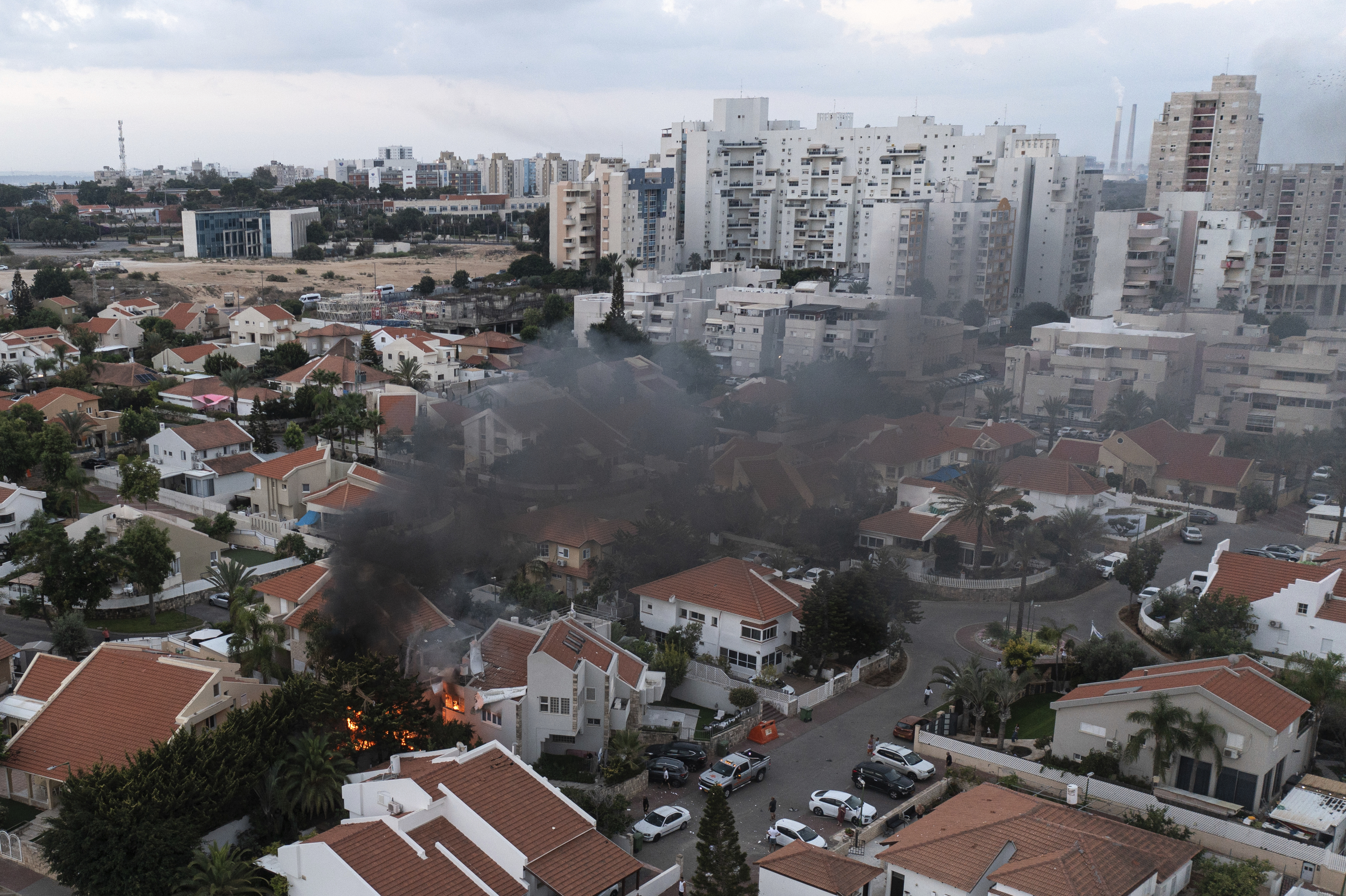 Smoke rises after a rocket fired from the Gaza Strip hit a house in Ashkelon, southern Israel, today. The rockets were fired as Hamas announced a new operation against Israel. Photo / AP