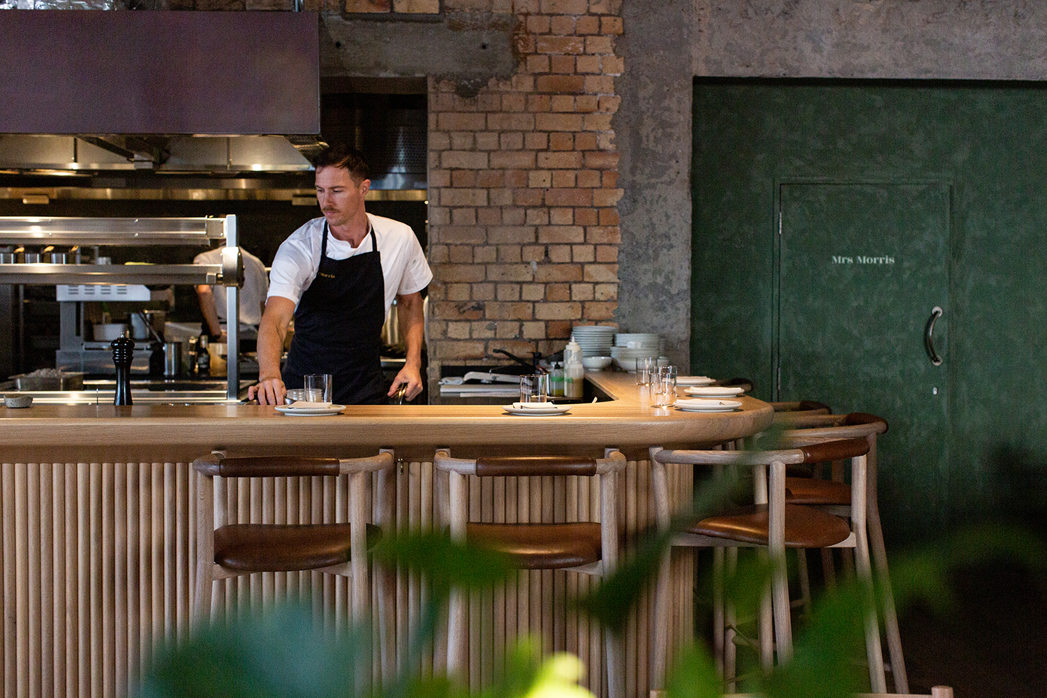 Diners can see the restaurant's chefs from over the central island. Photo / Babiche Martens