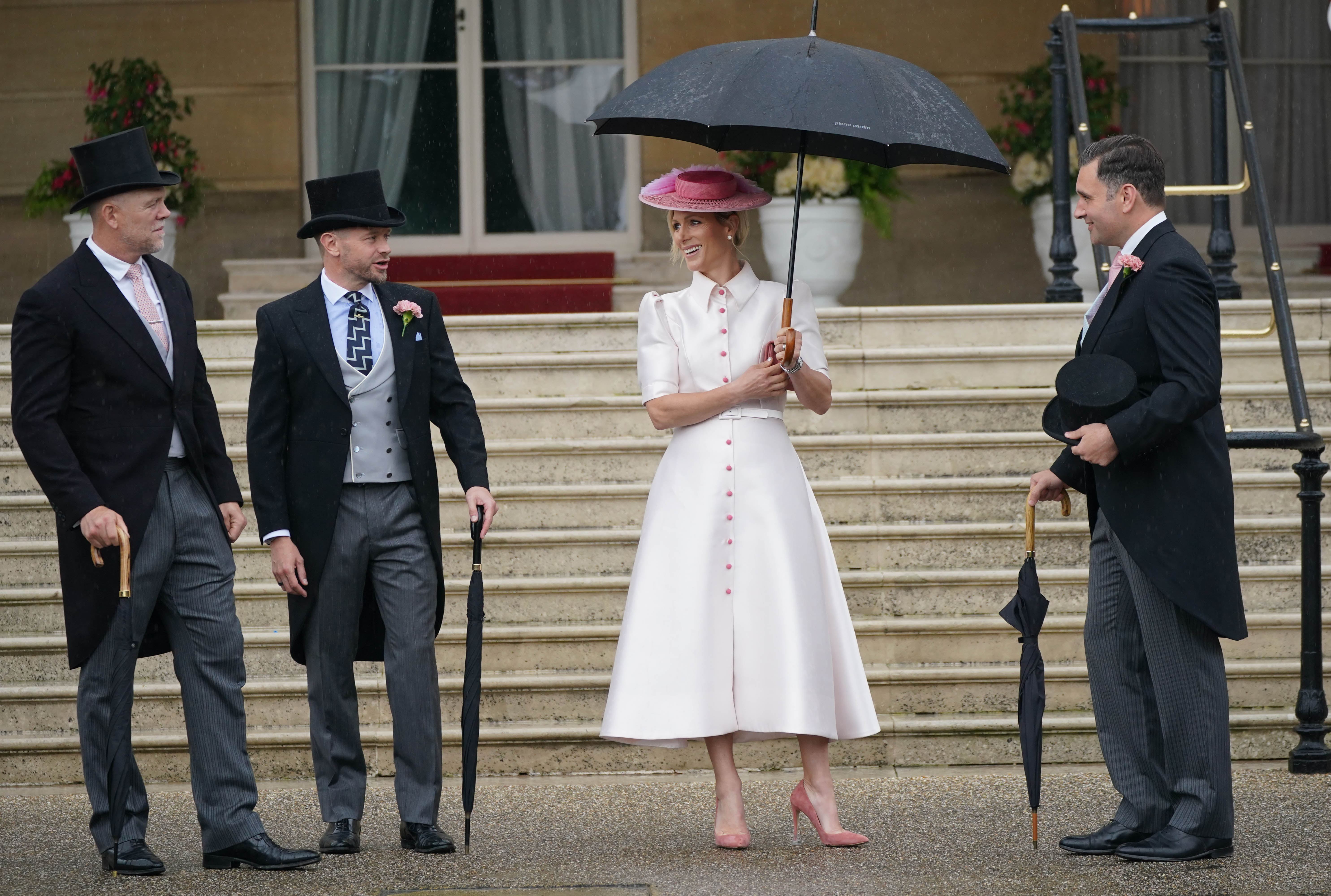 Zara (centre) and Mike Tindall (left) arrive at the Sovereign's Garden Party at Buckingham Palace. Photo / Getty Images