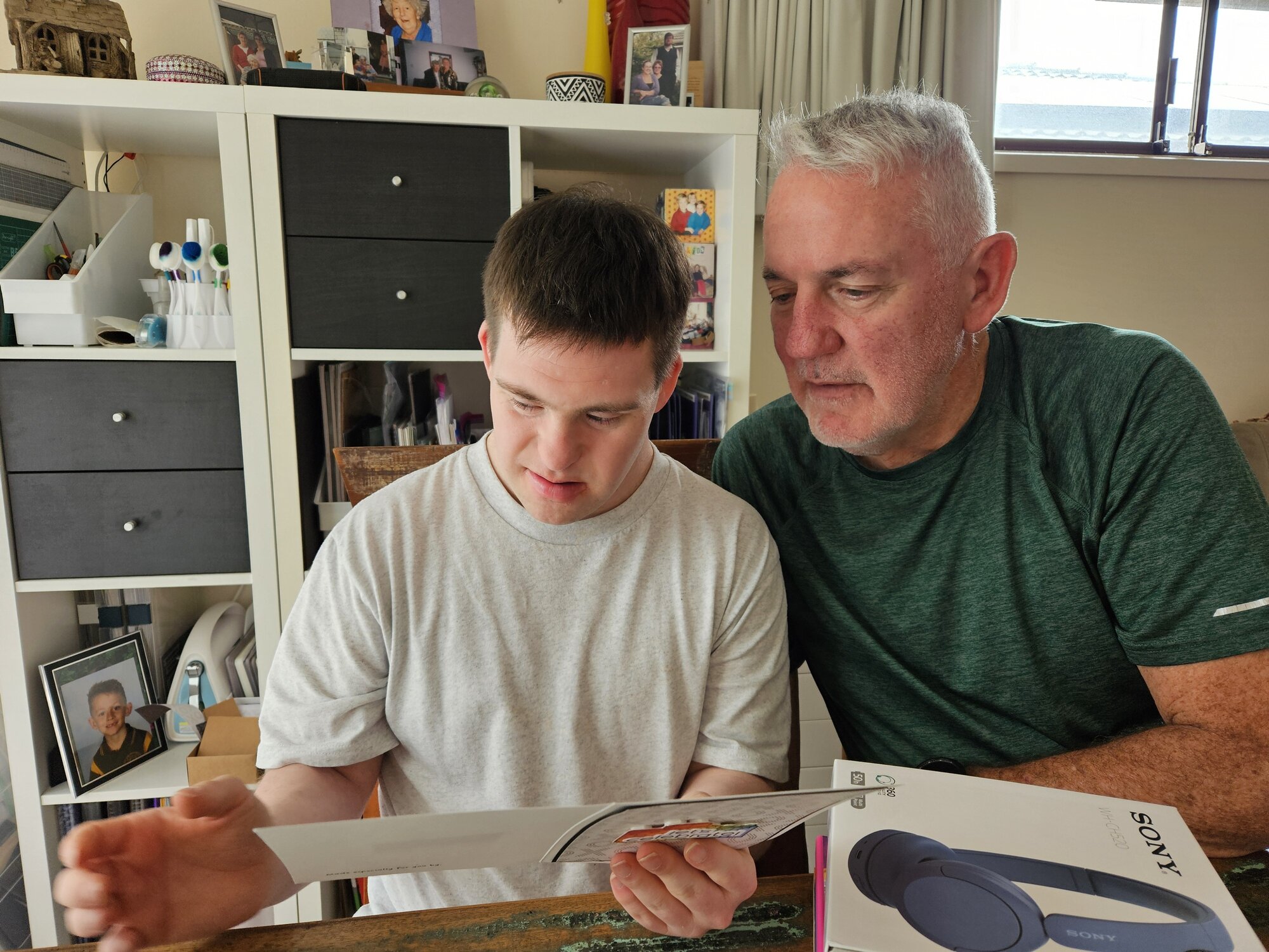 Jack Murphy (left) and his father Mike Murphy in their home in Christchurch. Jack, 27, had lined up a residential placement before a funding change meant it was no longer possible. 
